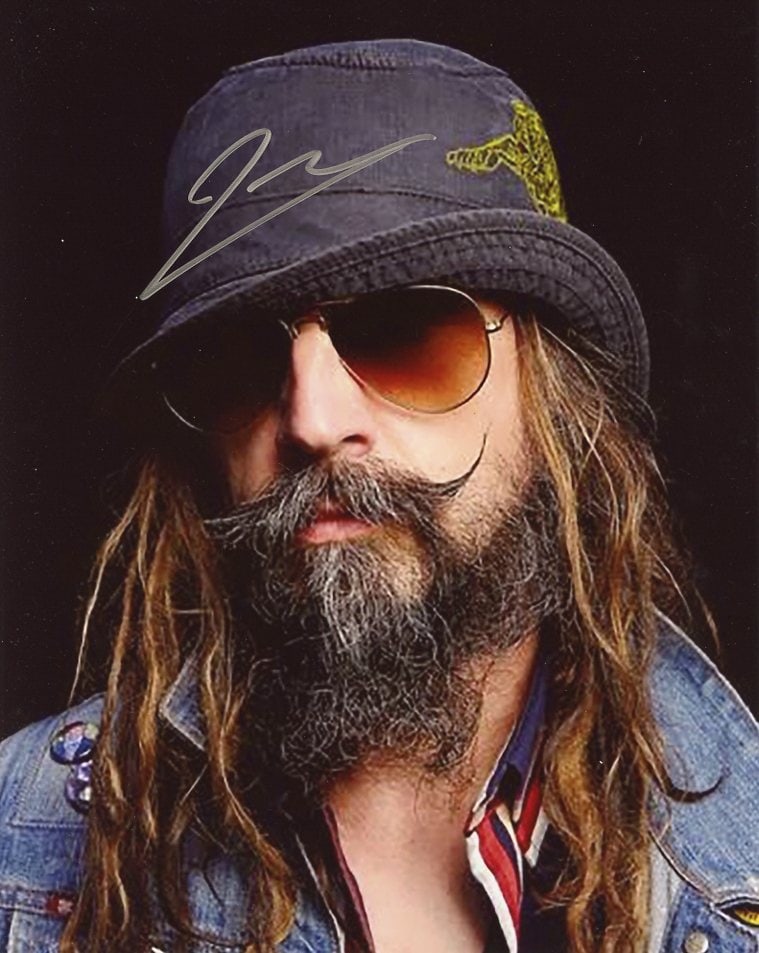 Rob Zombie ACTOR / DIRECTOR / SINGER In Person Signed Photo: Photo size is 8x10. Rob Zombie in person signed photo. Rob Zombie is an American singer, songwriter, record producer, filmmaker, and actor. His music and lyrics are notable for their horror and sci-fi