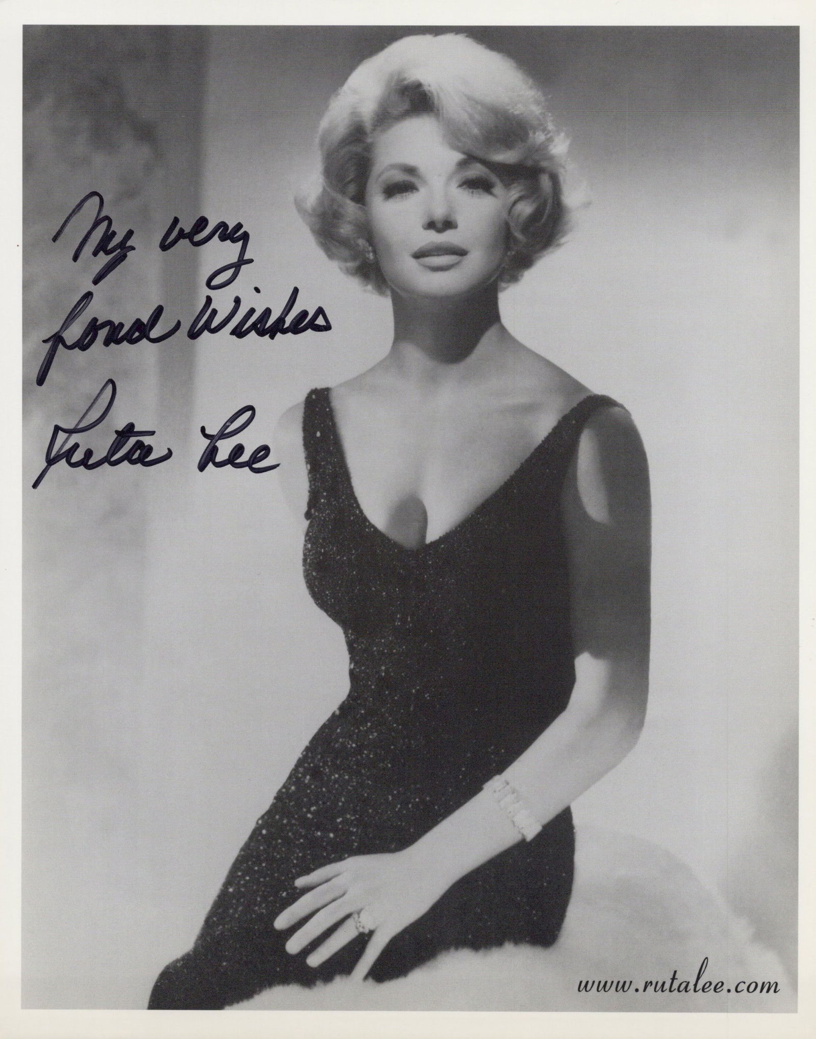 Ruta Lee 7 BRIDES / FUNNY FACE In Person Signed Photo: Photo size is 8x10. Ruta Lee in person signed photo. Ruta Lee has done such movies as DOOMSDAY MACHINE, WITNESS FOR THE PROSECUTION, and SEVEN BRIDES FOR SEVEN BROTHERS