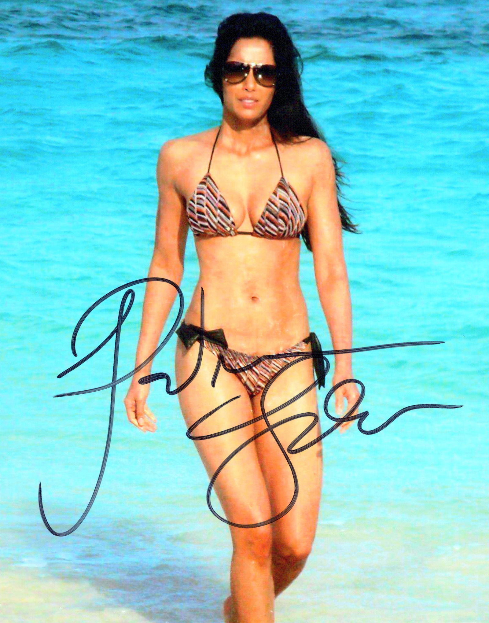 Padma Lakshmi TOP CHEF / GLITTER In Person Signed Photo: Photo size is 8x10. Padma Lakshmi in person signed photo. Padma Parvati Lakshmi is an Emmy-nominated producer, host, author, and activist who uses food to explore culture, identity, and immigration. S