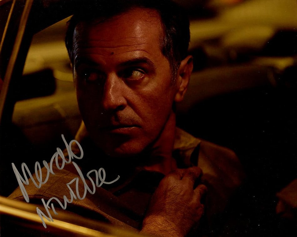 Merab Ninidze MCMAFIA In Person Signed Photo: Photo size is 8x10. Merab Ninidze in person signed autographed photo from the movie MCMAFIA. Merab Ninidze as the character Vadim Kalyagin.
