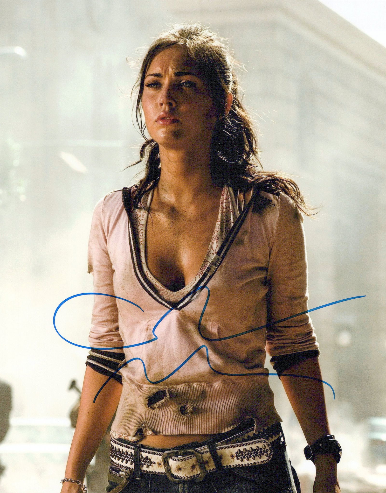 Megan Fox TRANSFORMERS In Person Signed Photo: Photo size is 8x10. Megan Fox in person signed photo from the movie TRANSFORMERS. Megan Fox as the character Mikaela Banes.