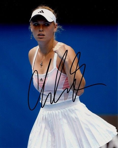 Caroline Wozniacki TENNIS In Person Signed Photo: Photo size is 8x10. Caroline Wozniacki in person signed autographed photo. Caroline Wozniacki is a Danish former professional tennis player. She was ranked world No. 1 in singles for a total of 71 wee