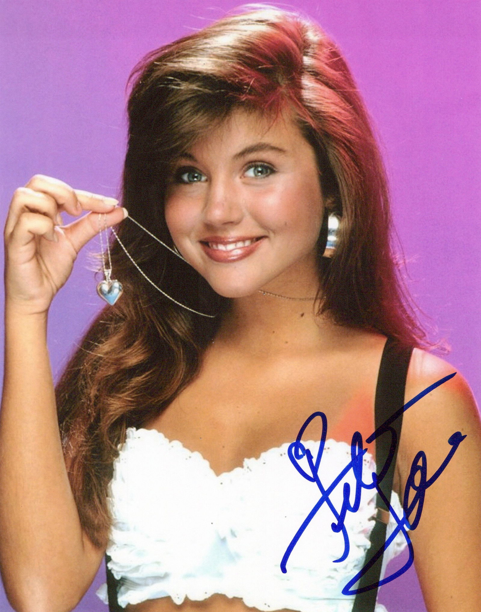 Tiffani Amber Thiessen SAVED BY THE BALL In Person Signed Photo: Photo size is 8x10. Tiffani Amber Thiessen in person signed photo from the TV series SAVED BY THE BELL. Tiffani Amber Thiessen as the character Kelly Kopowski.