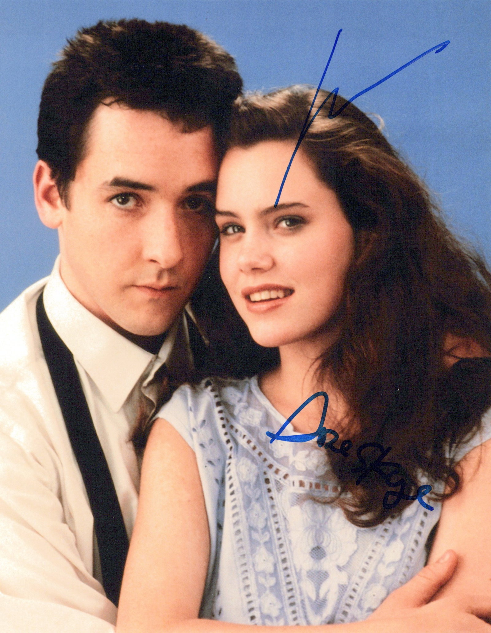 John Cusack / Ione Skye SAY ANYTHING In Person Signed Photo: Photo size is 8x10. John Cusack / Ione Skye in person signed photo from the movie SAY ANYTHING. John Cusack as the character Lloyd Dobler. Ione Skye as the character Diane Court.
