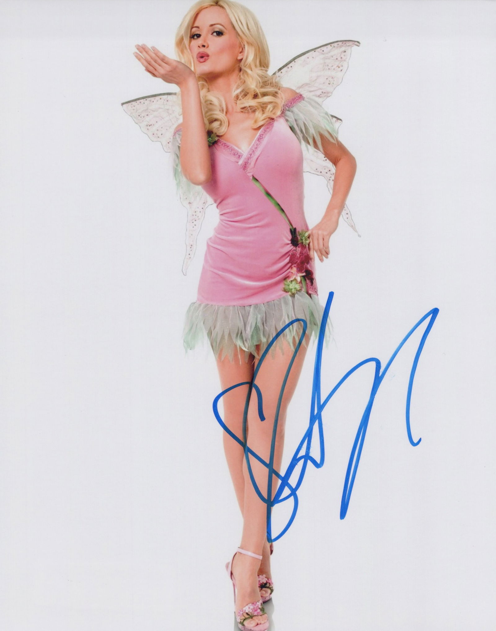Holly Madison PLAYBOY In Person Signed Photo: Photo size is 8x10. Holly Madison in person signed photo. Holly Madison is an actress, television personality, and New York Times bestselling author. Madison is best known for her appearance on the re