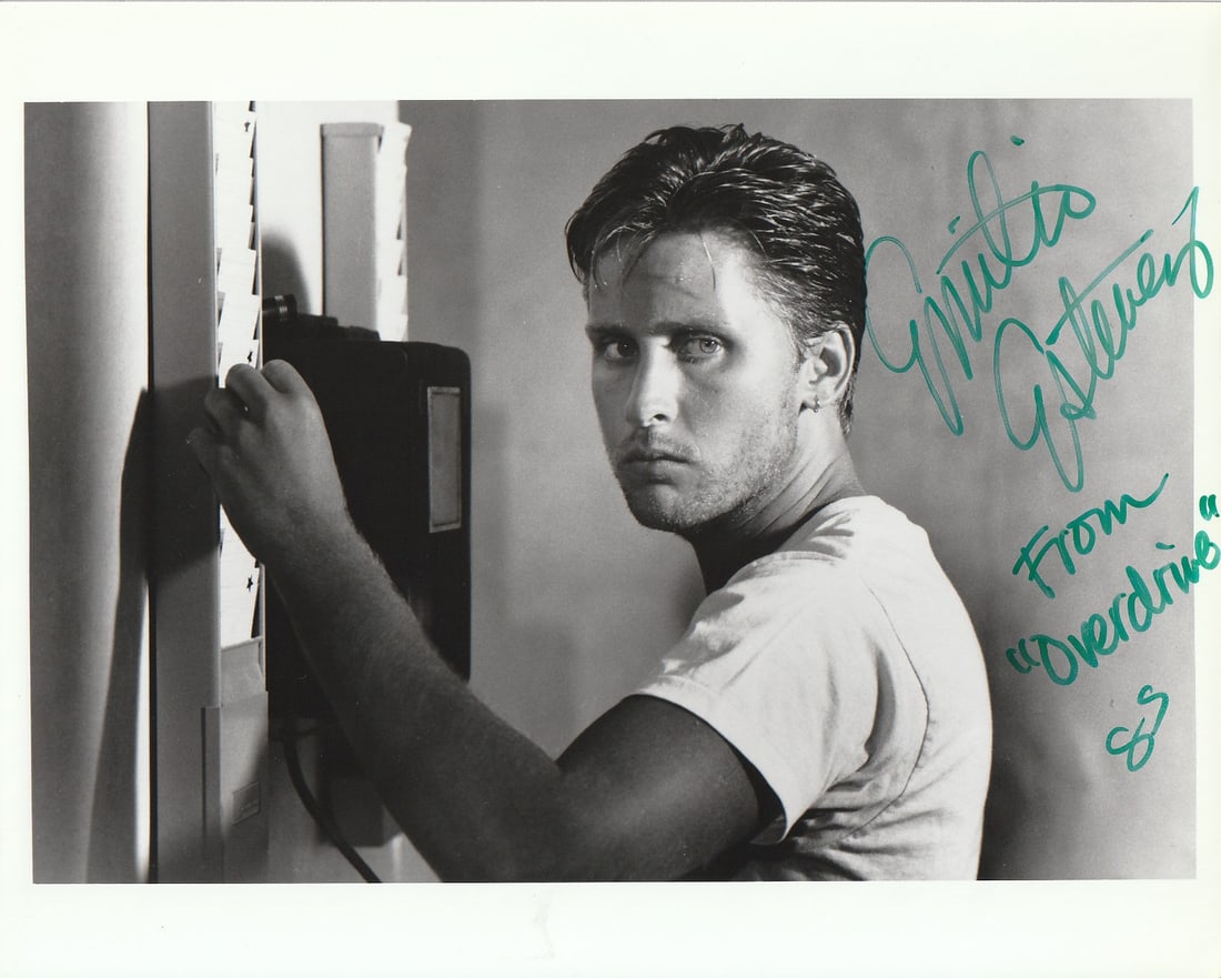 Emilio Estevez MAXIMUM OVERDRIVE In Person Signed Photo: Photo size is 8x10. Emilio Estevez in persons signed photo from the movie MAXIMUM OVERDRIVE. Emilio Estevez as the character Bill RObinson Nelson.