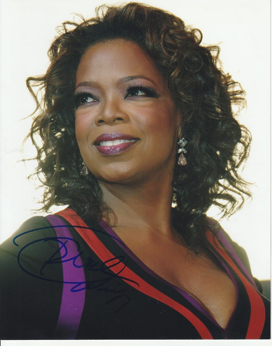 Oprah Winfrey TALKSHOW / COLOR PURPLE In Person Signed Photo: Photo size is 8x10. Oprah Winfrey in person signed photo. Oprah Winfrey is an American media leader, actress, producer, and philanthropist. She's best known for hosting the popular syndicated talk sho