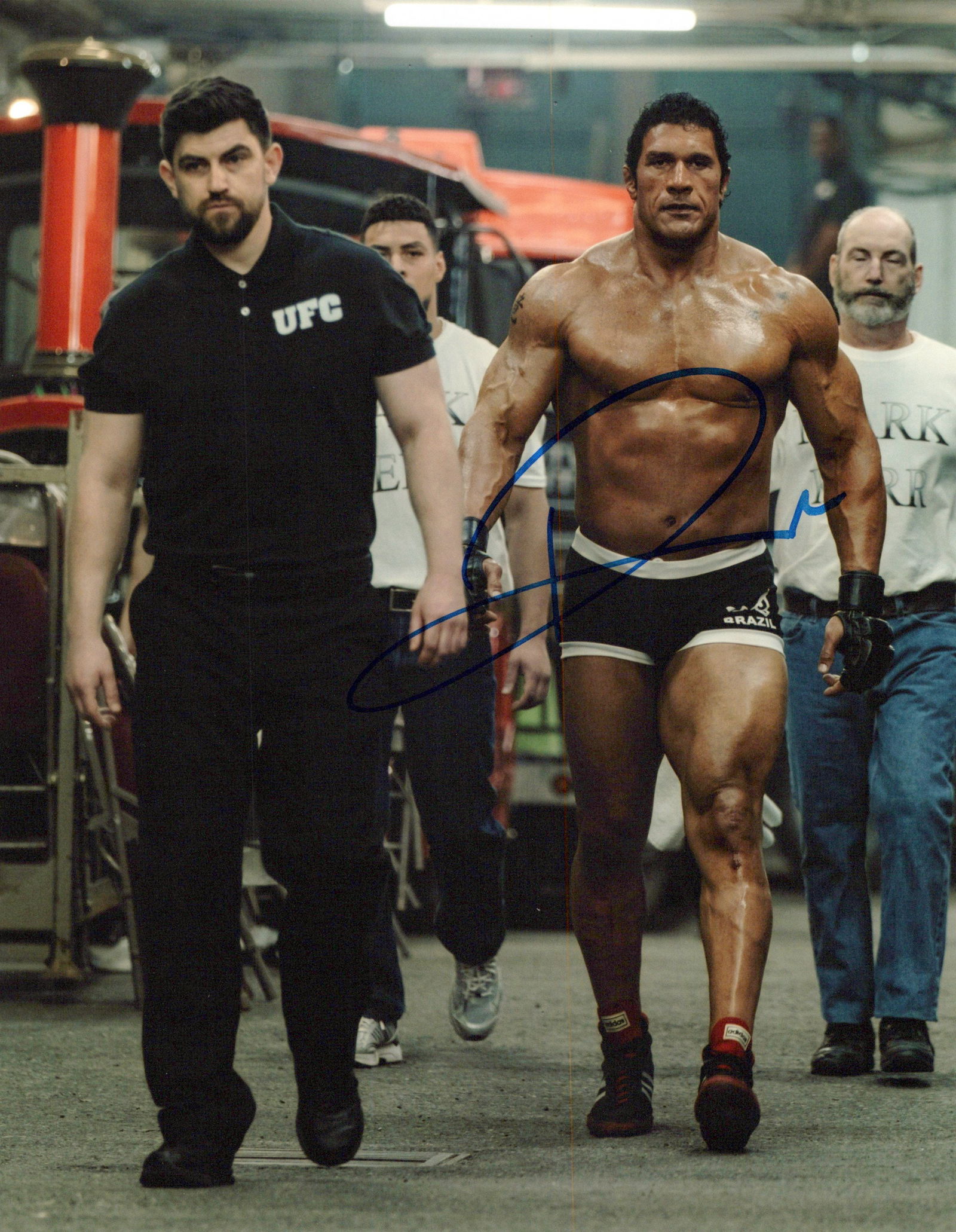 Dwayne Johnson SMASHING MACHINE In Person Signed Photo: Photo size is 8x10. Dwayne Johnson in person signed photo from the movie THE SMASHING MACHINE. Dwayne Johnson as the character MMA fighter Mark Kerr