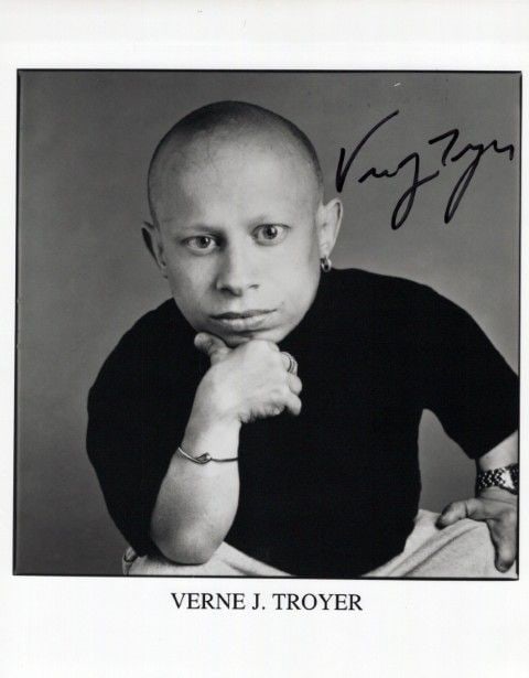 Vern Troyer (1969-2018) AUSTIN POWERS / LOVE GURU In Person Signed Photo: Photo size is 8x10. Vern Troyer (1969-2018) in person signed photo. Vern Troyer has done such movies as THE LOVE GURU, AUSTIN POWERS, and BUBBLE BOY.