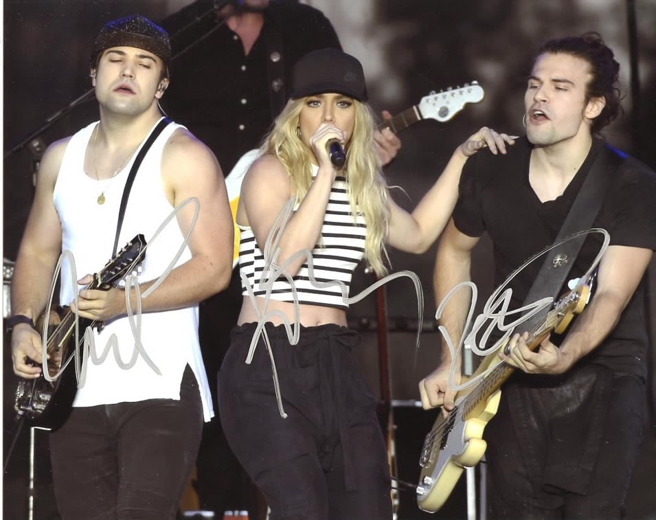 Kimberly - Reid and Neil Perry THE BAND PERRY In Person Signed Photo: Photo size is 8x10. Kimberly - Reid and Neil Perry in person signed photo from the country group THE BAND PERRY. The Band Perry is a music group composed of siblings Kimberly Perry, Reid Perry, and Ne