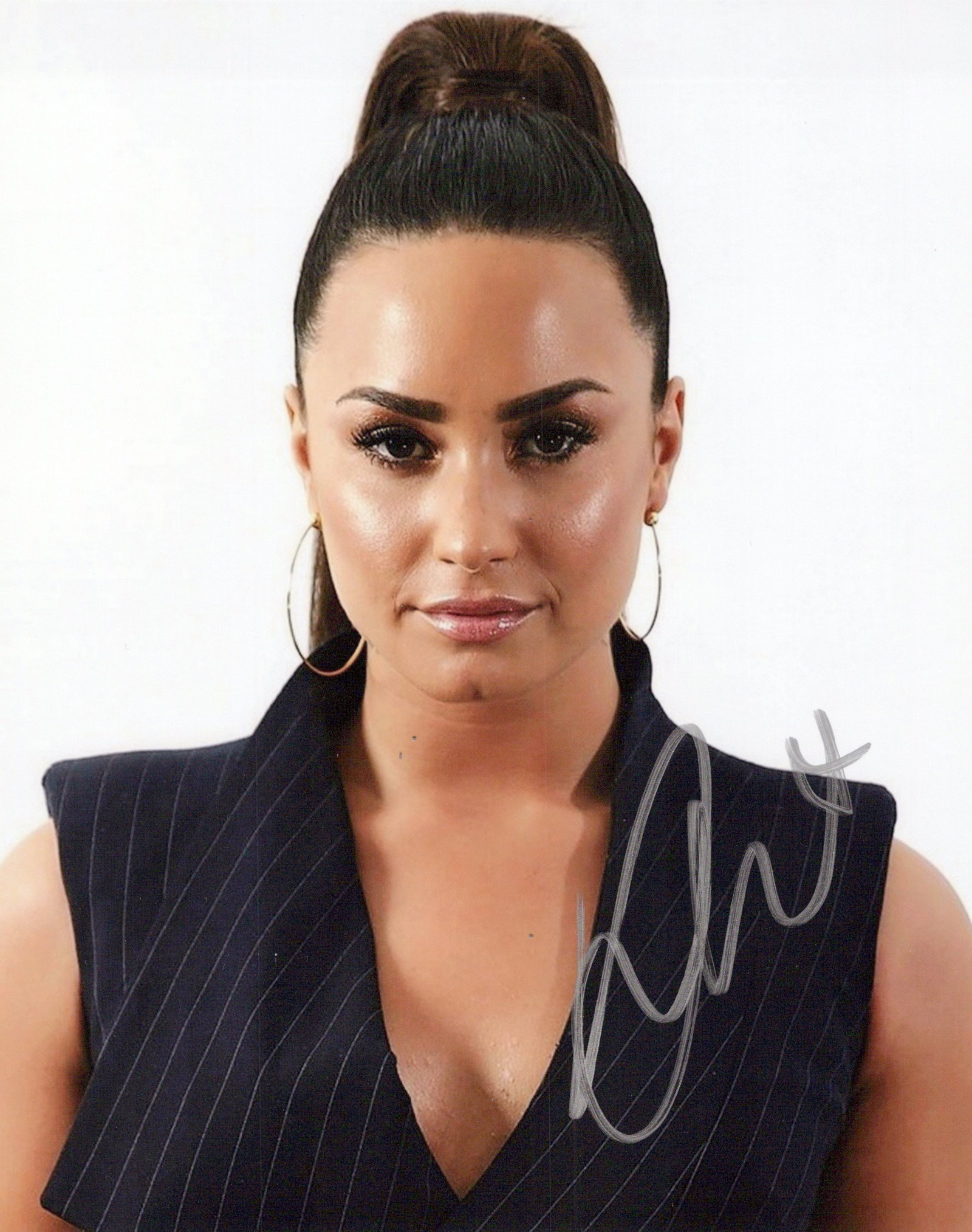 Demi Lovato CAMP ROCK / GORGEOUS In Person Signed Photo: Photo size is 8x10. Demi Lovato in person signed autographed photo. Demi Lovato is an American singer, songwriter, and actress. After appearing on the children's television series Barney & Friends, Lo