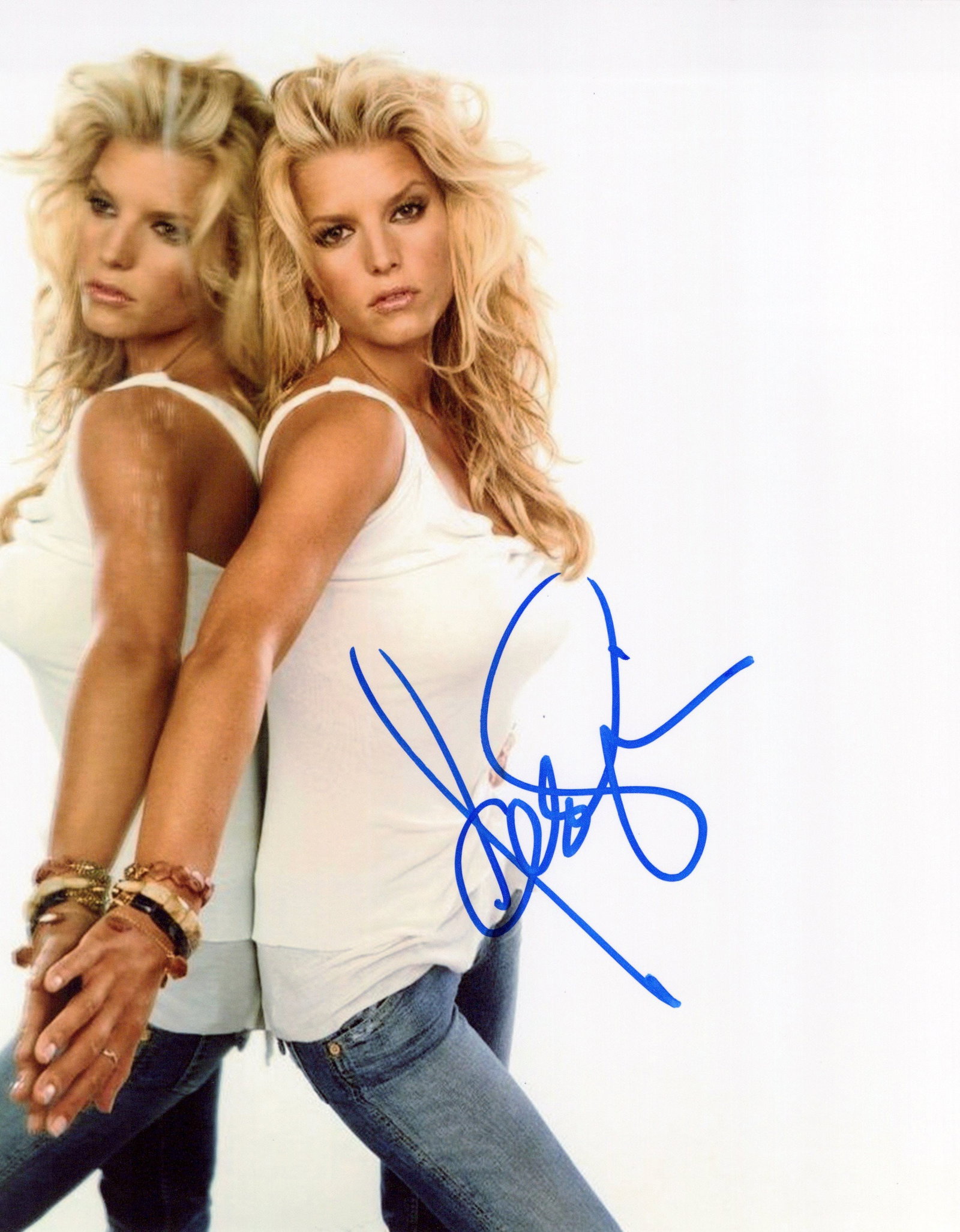 Jessica Simpson SEXY In Person Signed Photo: Photo size is 8x10. Jessica Simpson in person signed autographed photo. Jessica Simpson is an American singer, actress, fashion designer, and author. After performing in church choirs as a child, Simp