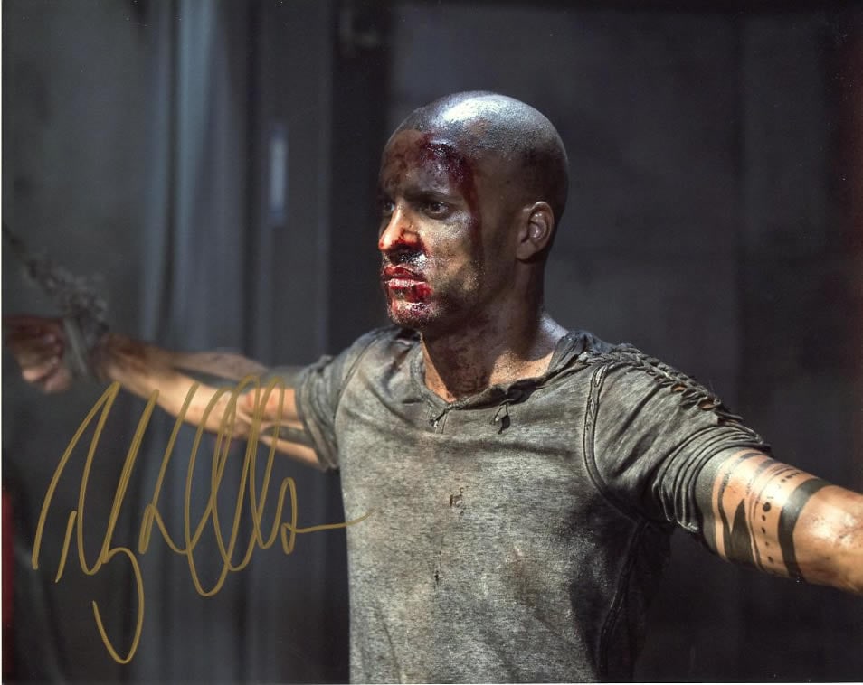 Ricky Whittle THE 100 In Person Signed Photo: Photo size is 8x10. Ricky Whittle in person signed autographed photo from the TV series THE 100. Ricky Whittle as the character Lincoln