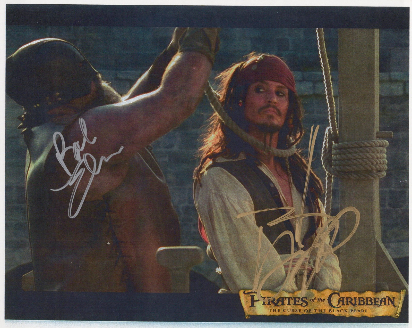 Johnny Depp / Bob Elmore PIRATES OF THE CARIBBEAN In Person Signed Photo: Photo size is 8x10. Johnny Depp / Bob Elmore in person signed photo from the movie PIRATES OF THE CARIBBEAN THE CURSE OF THE BLACK PEARL. Johnny Depp as the character Jack sparrow. Bob Elomore had