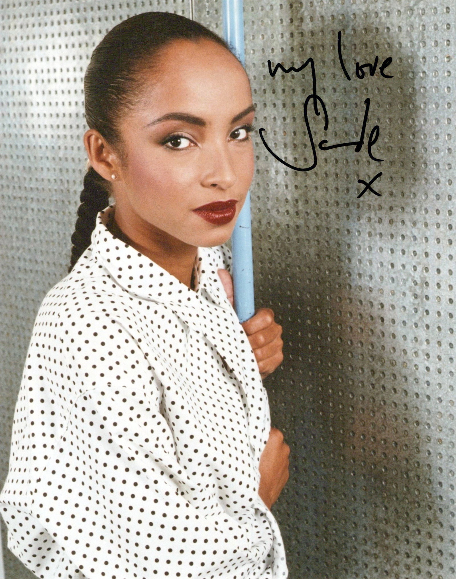 Sade Adu SINGER In Person Signed Photo: Photo size is 8x10. Sade Adu in person signed photo. Sade is a Nigerian-British singer, songwriter, and the lead vocalist of the band Sade. Her signature sound blends jazz, soul, and R&B, and is known