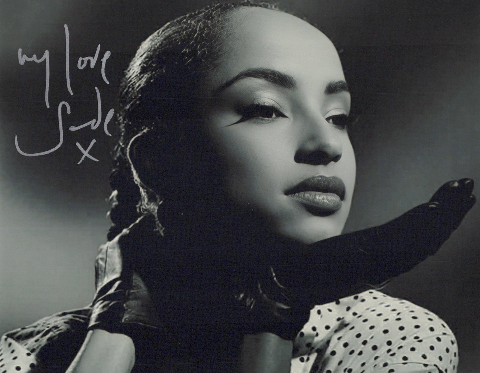 Sade Adu SINGER In Person Signed Photo: Photo size is 8x10. Sade Adu in person signed photo. Sade is a Nigerian-British singer, songwriter, and the lead vocalist of the band Sade. Her signature sound blends jazz, soul, and R&B, and is known