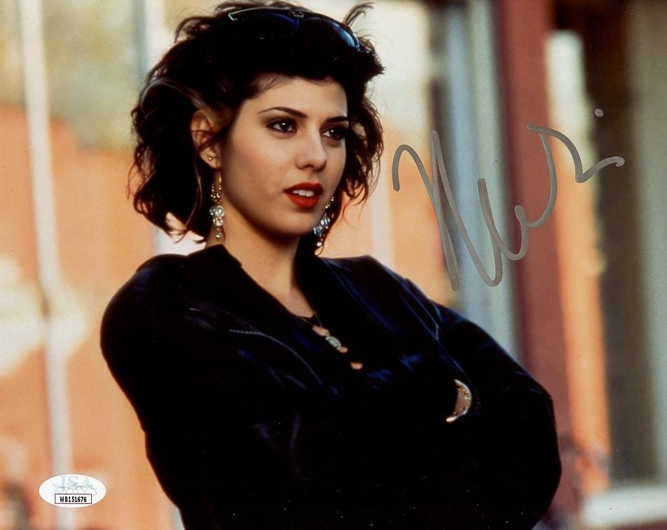 Marisa Tomei MY COUSIN VINNY (JSA) In Person Signed Photo: Photo size is 8x10. These are JSA Authenticated from a Private Signing. Marisa Tomei in person signed autographed photo from the movie MY COUSIN VINNY. Marisa Tomei as the character Mona Lisa Vito.
