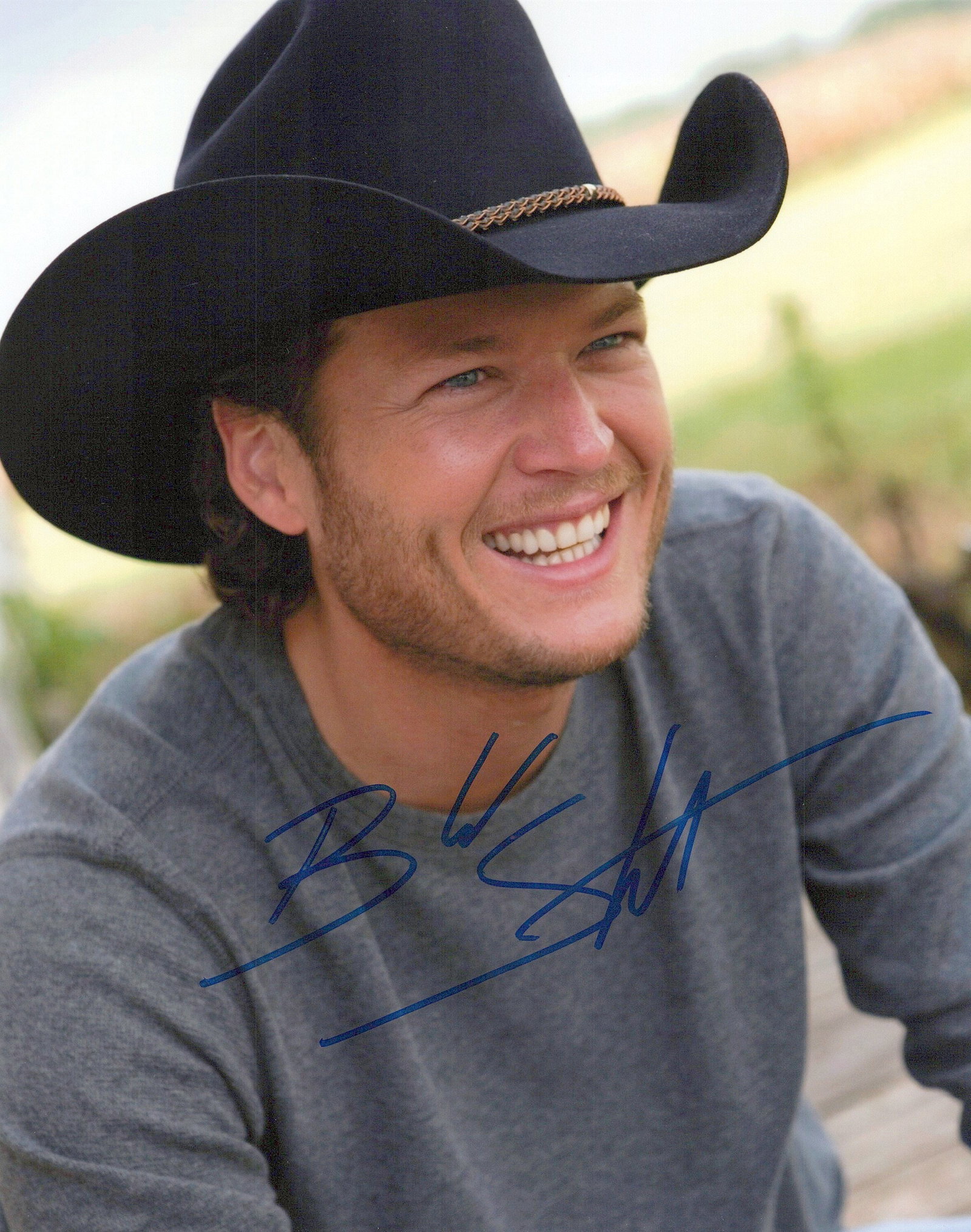 Blake Shelton COUNTRY SUPERSTAR In Person Signed Photo: Photo size is 8x10. Blake Shelton in person signed photo. Blake Shelton is an American country music singer and television personality. In 2001, he made his debut with the single "Austin". The lead-of