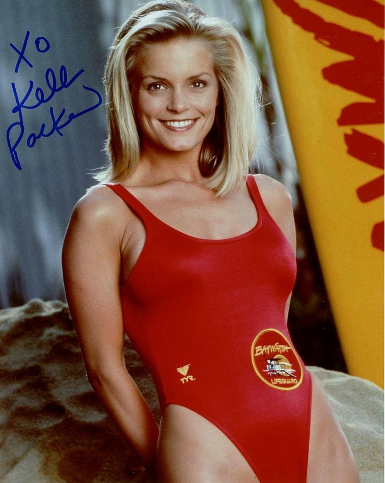 Kelly Packard BAYWATCH In Person Signed Photo: Photo size is 8x10. Kelly Packard in person signed photo from the TV series BAYWATCH. Kelly Packard as the character April Giminski