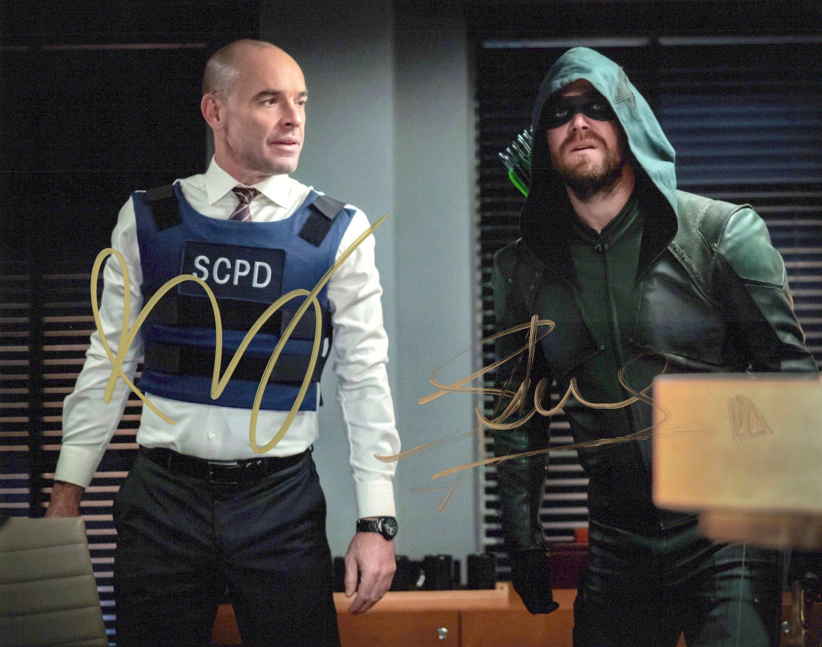 Stephen Amell / Paul Blackthorne ARROW In Person Signed Photo: Photo size is 8x10. Stephen Amell / Paul Blackthorne in person signed photo from the TV series ARROW. Stephen Amell as the character Oliver Queen / Arrow. Paul Blackthorne as the character Quinton Lan