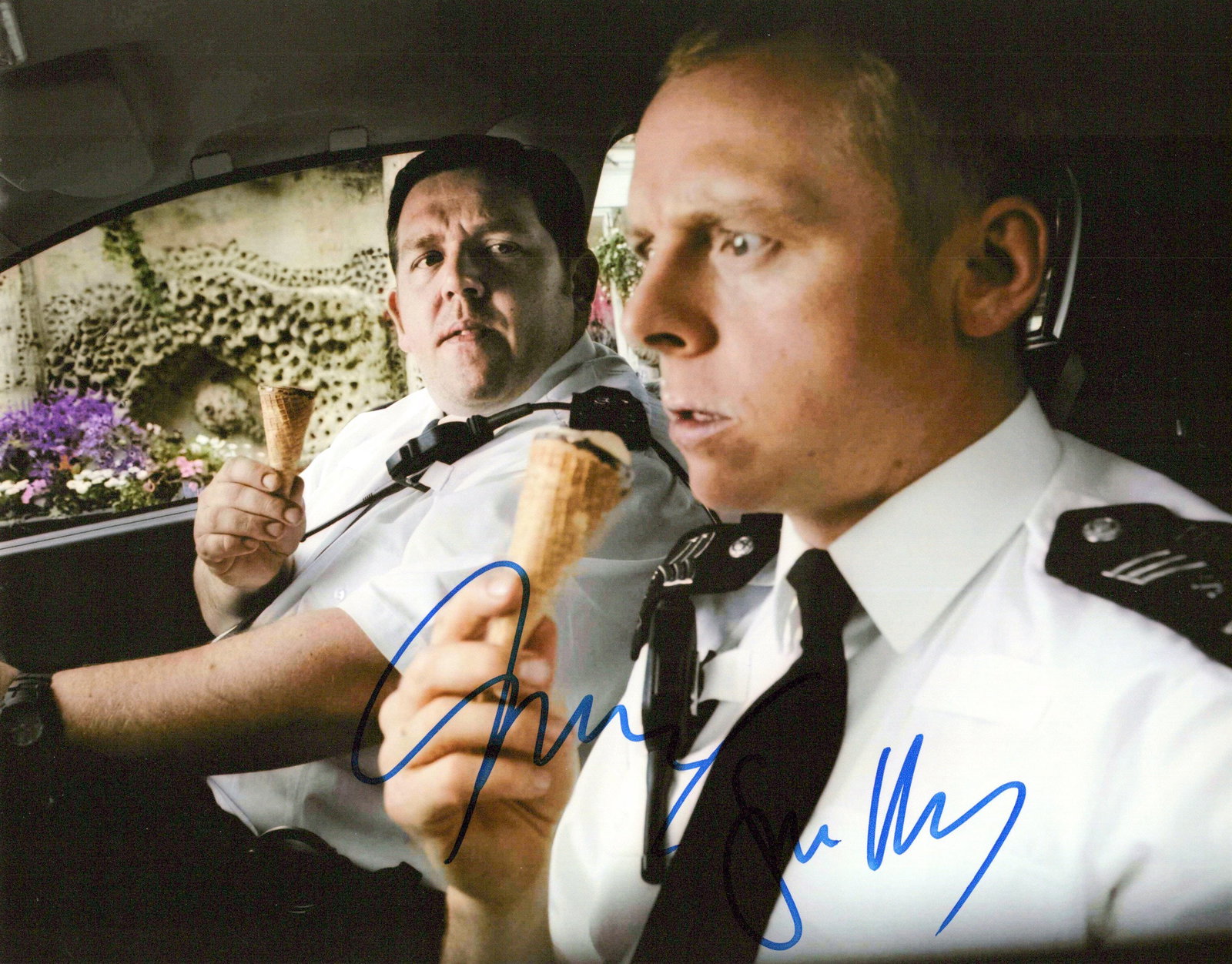 Simon Pegg / Nick Frost HOT FUZZ In Person Signed Photo: Photo size is 8x10. Simon Pegg / Nick Frost in person signed photo from the movie HOT FUZZ. Simon Pegg as the character Nicholas Angel. Nick Frost as the character Danny Butterman