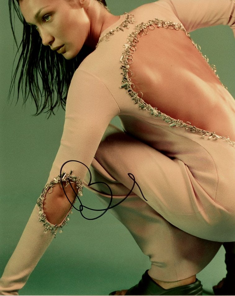 Bella Hadid MODEL In Person Signed Photo: Photo size is 8x10. Bella Hadid in person signed autographed photo. Isabella Hadid is an American model. In 2016, she was voted "Model of the Year" by industry professionals for Models.com.