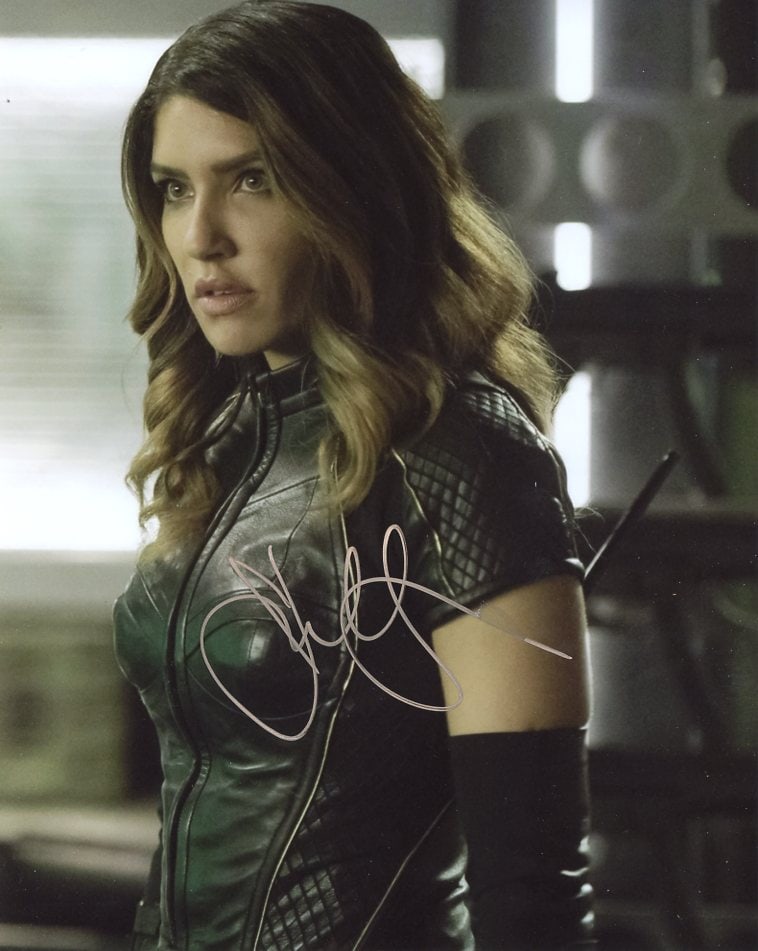 Juliana Harkavy ARROW In Person Signed Photo: Photo size is 8x10. Juliana Harkavy in person signed autographed photo from the TV series ARROW. Juliana Harkavy as the character Dinah Drake / Black Canary