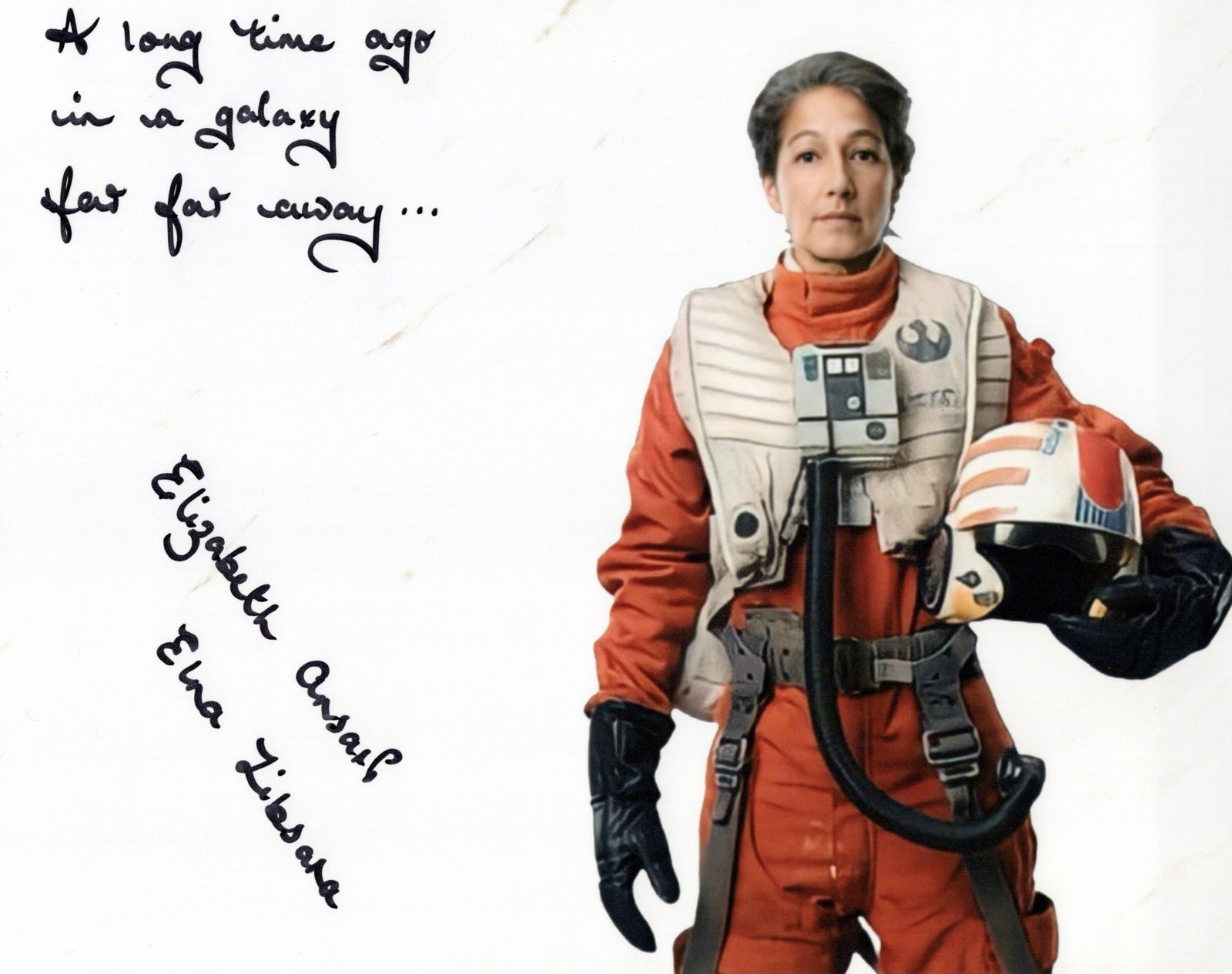 Elizabeth Ansari STAR WARS In Person Signed Photo: Photo size is 8x10. Elizabeth Ansari in person signed photo from the movie STAR WARS THE RISE OF SKYWALKER. Elizabeth Ansari as the characterElna Zibsara. She has also added " A long time ago in a gal
