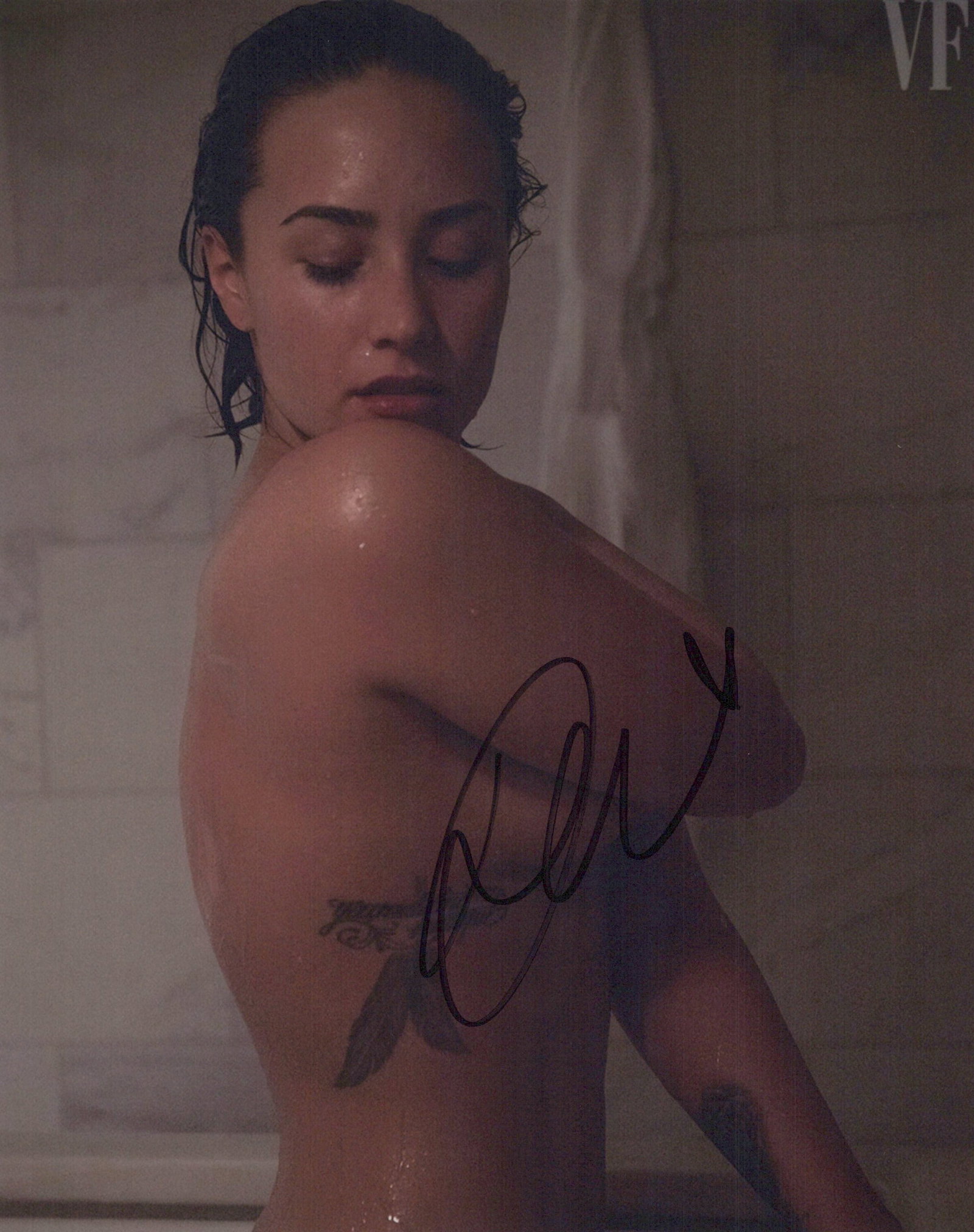Demi Lovato SINGER / SEXY In Person Signed Photo: Photo size is 8x10. Demi Lovato in person signed autographed photo. Demi Lovato is an American singer, songwriter, and actress. After appearing on the children's television series Barney & Friends, Lo