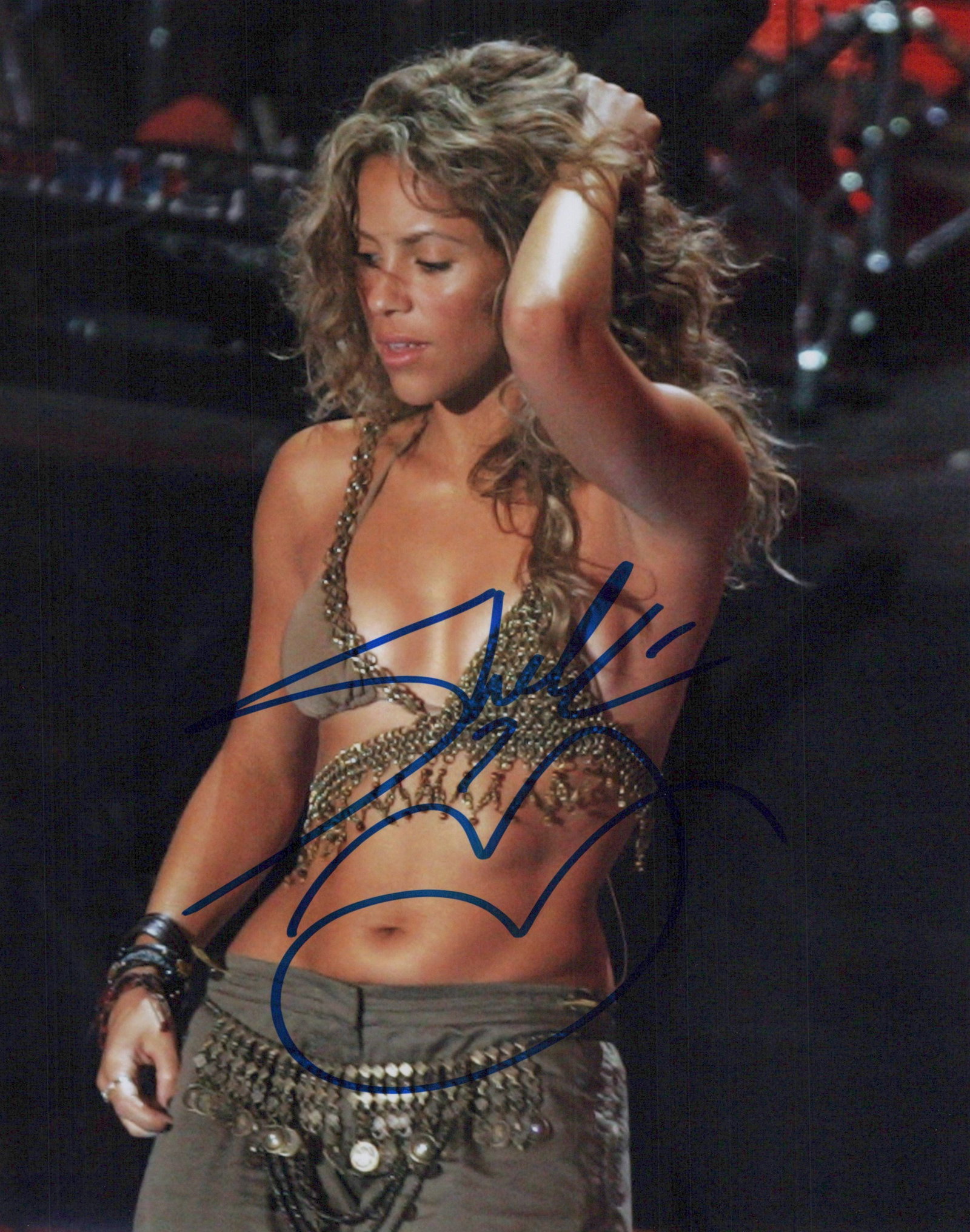 Shakira SINGER / SEXY In Person Signed Photo: Photo size is 8x10. Shakira in person signed photo. Shakira Isabel Mebarak Ripoll, known mononymously as Shakira, is a Colombian singer and songwriter. Born and raised in Barranquilla, she has been re