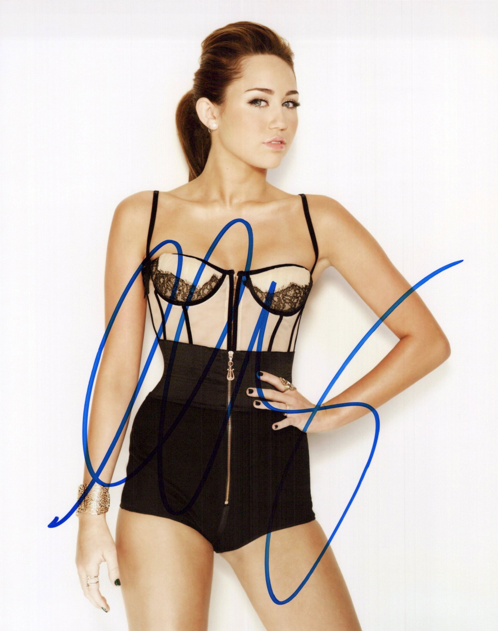 Miley Cyrus SEXY PLAYFUL In Person Signed Photo: Photo size is 8x10. Miley Cyrus hot in person signed photo. Miley Cyrus has been in such movies as THE LAST SONG, LOL, and HANNAH MONTANA