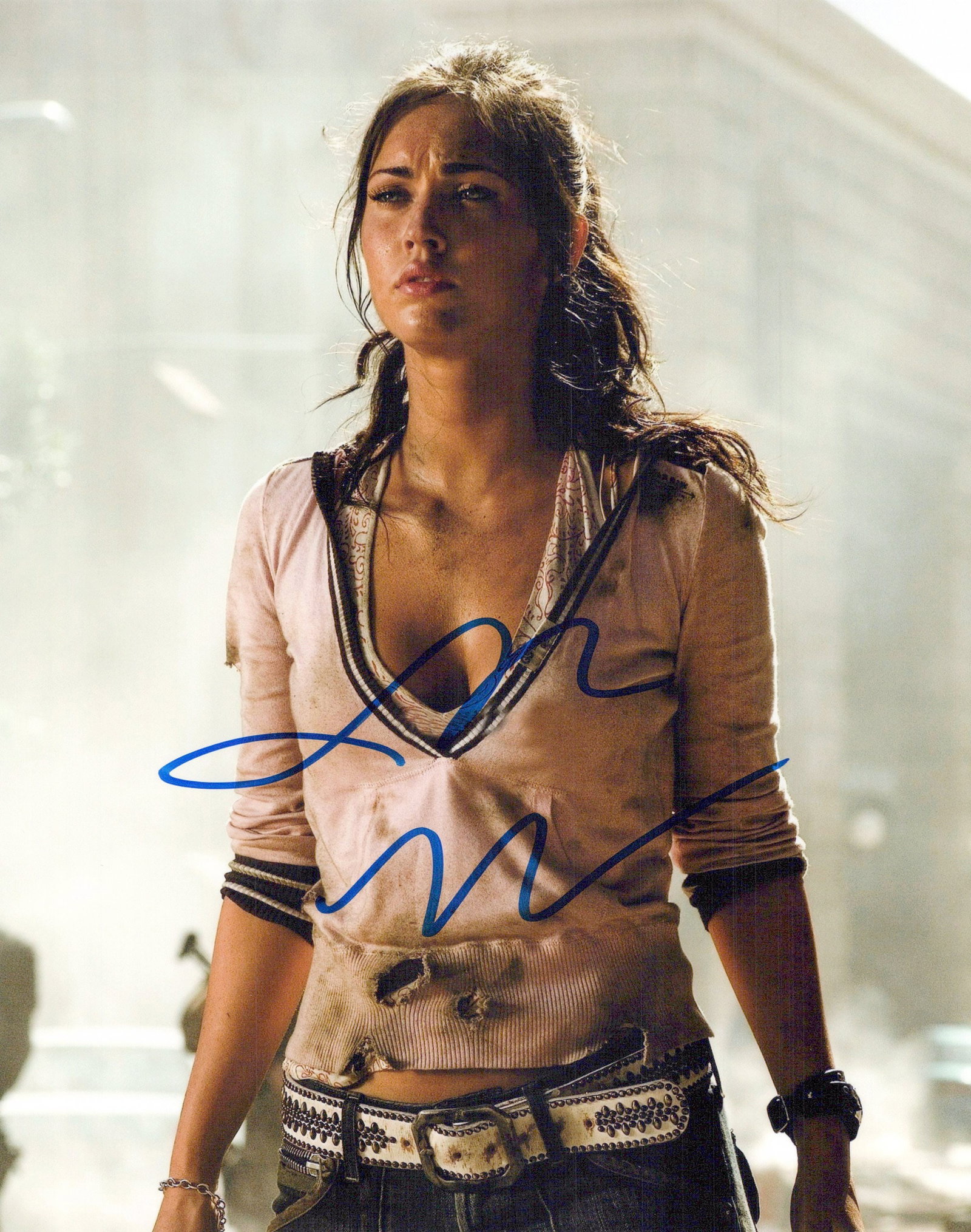 Megan Fox TRANSFORMERS In Person Signed Photo: Photo size is 8x10. Megan Fox in person signed photo from the movie TRANSFORMERS. Megan Fox as the character Mikaela Banes.
