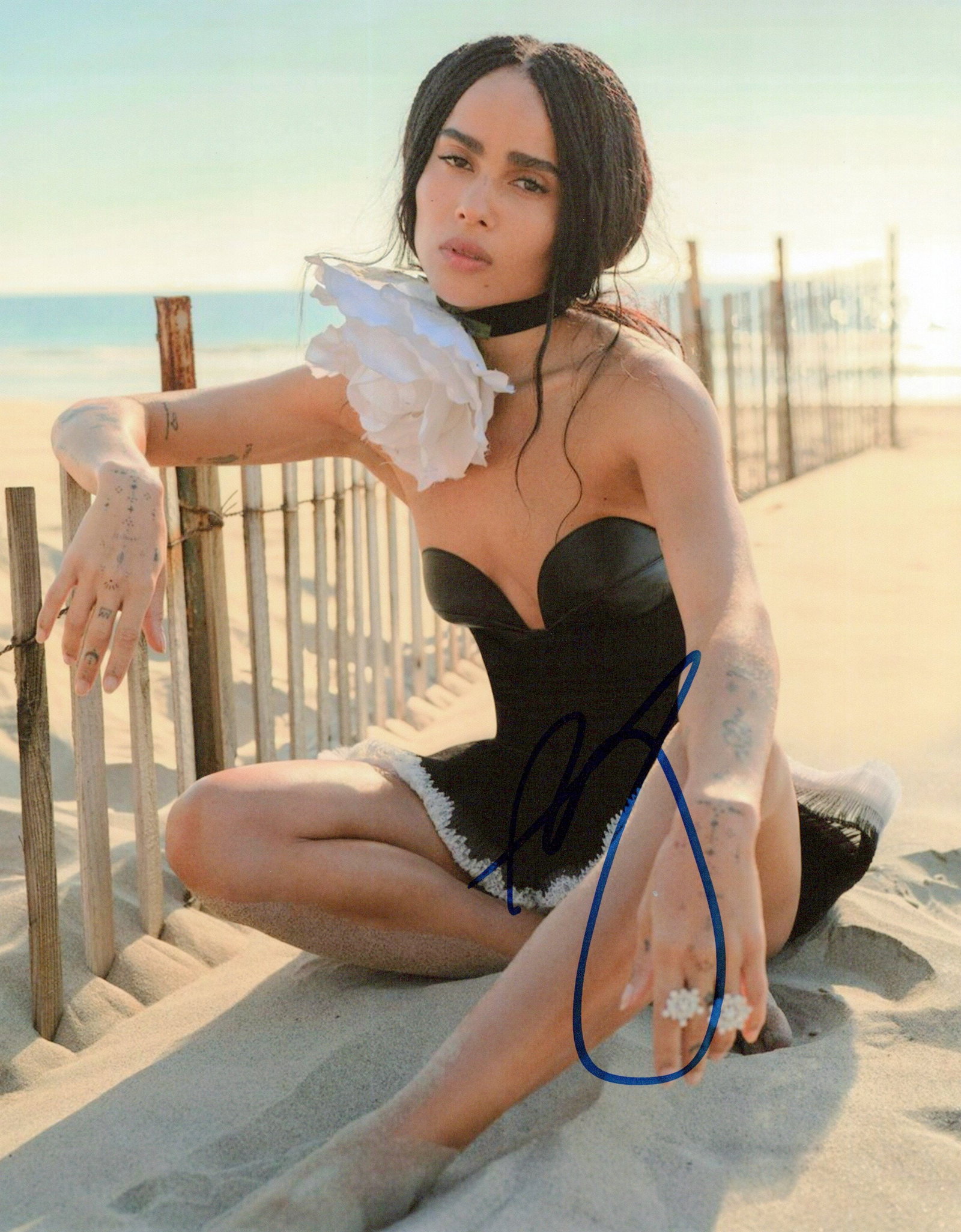 Zoe Kravitz BATMAN / X-MEN In Person Signed Photo: Photo size is 8x10. Zoe Kravitz sexy in person signed photo. Zoe Kravitz has done such movies as THE BATMAN, X-MEN FIRST CLASS, and MAD MAX FURY ROAD