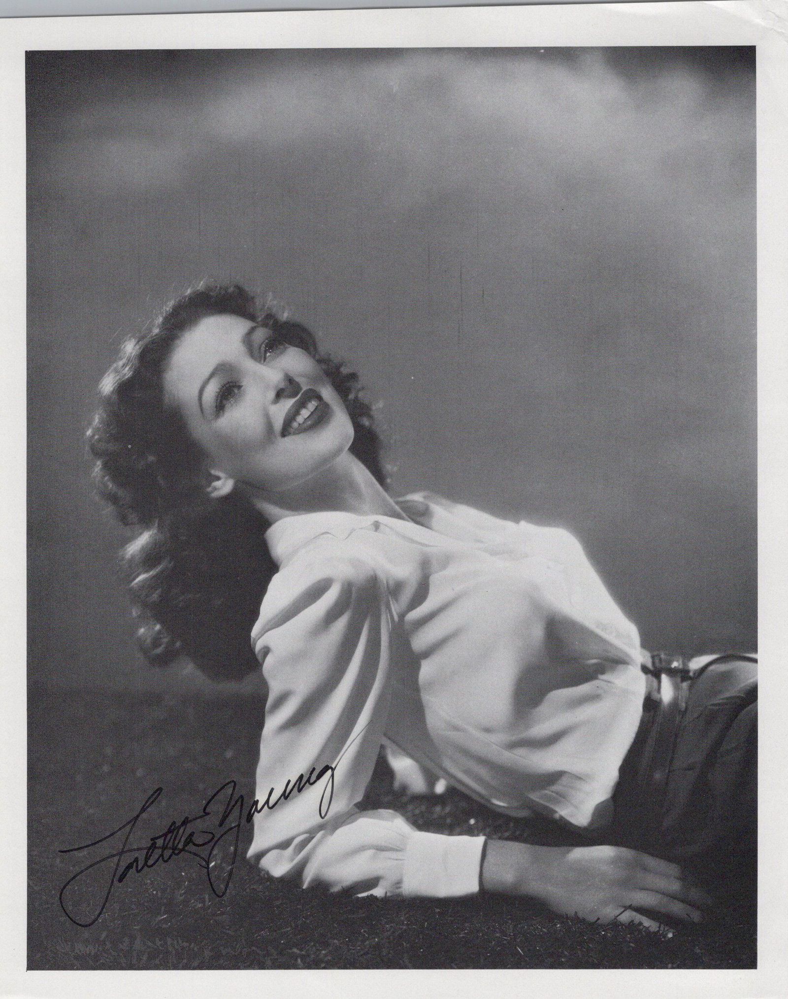 Loretta Young (1913-2000) THE STRANGER / MIDNIGHT MARY Signed Photo: Photo size is 9.25 x 7.5. Loretta Young (1913-2000) beautiful signed photo. Loretta Young has done such movies as THE STRANGER, MIDNIGHT MARY, and A NIGHT TO REMEMBER. This is a signed book page.