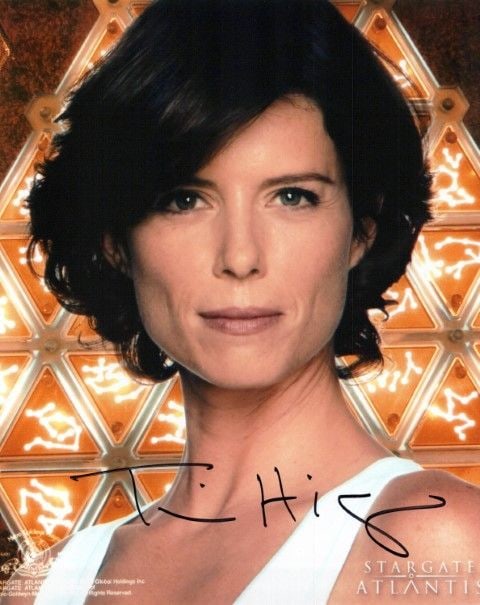 Torri Higginson STARGATE ATLANTIS In Person Signed Photo: Photo size is 8x10. Torri Higginson in person signed photo from the TV series STARGATE ATLANTIS. Torri Higginson as the character Dr. Elizabeth Weir.