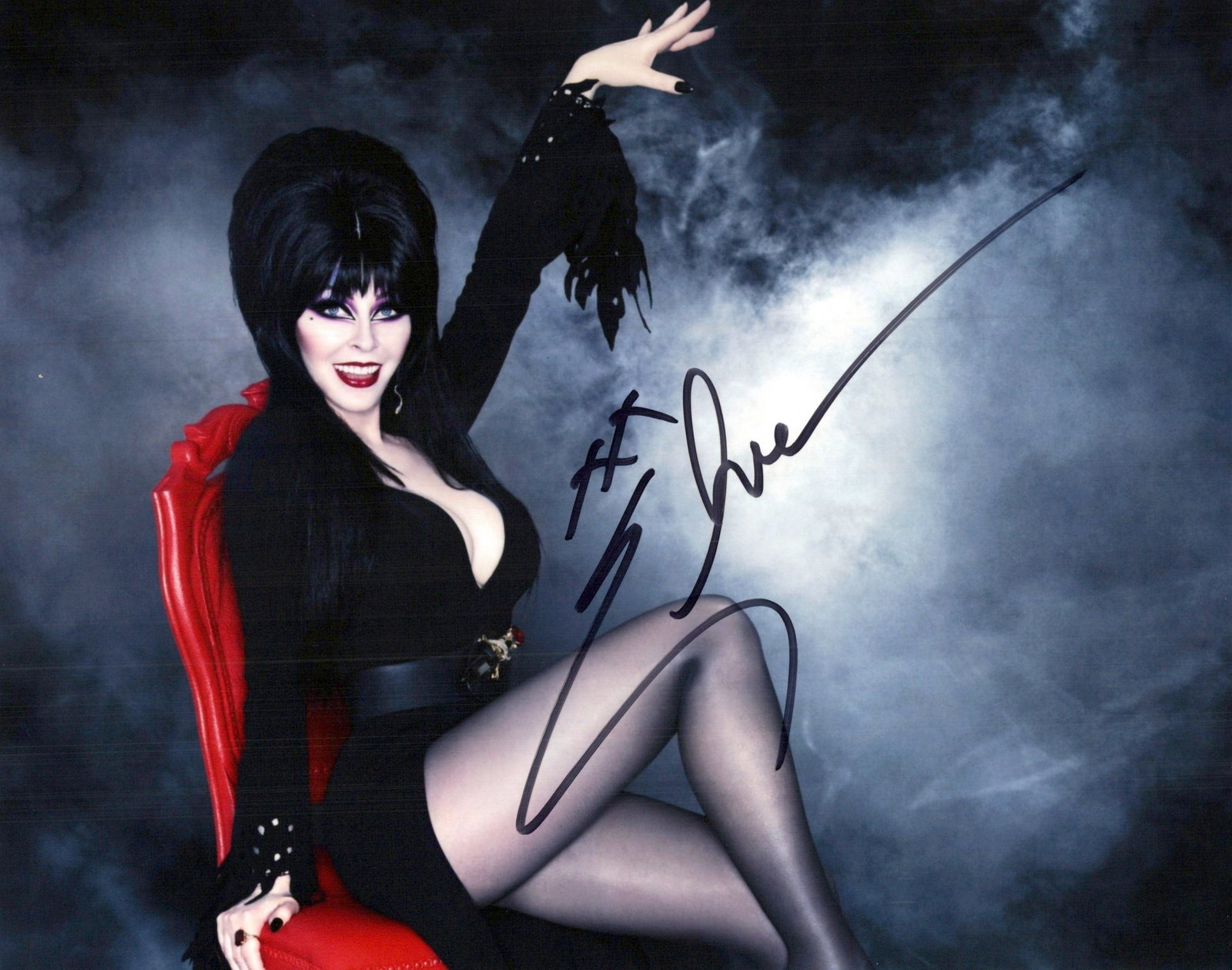 Elvira MISTRESS OF THE DARK In Person Signed Photo: Photo size is 8x10. PRIVATE SIGNING. Elvira in person signed autographed photo. Cassandra Peterson is an American actress, writer, and singer. She is best known for her portrayal of the horror hostess