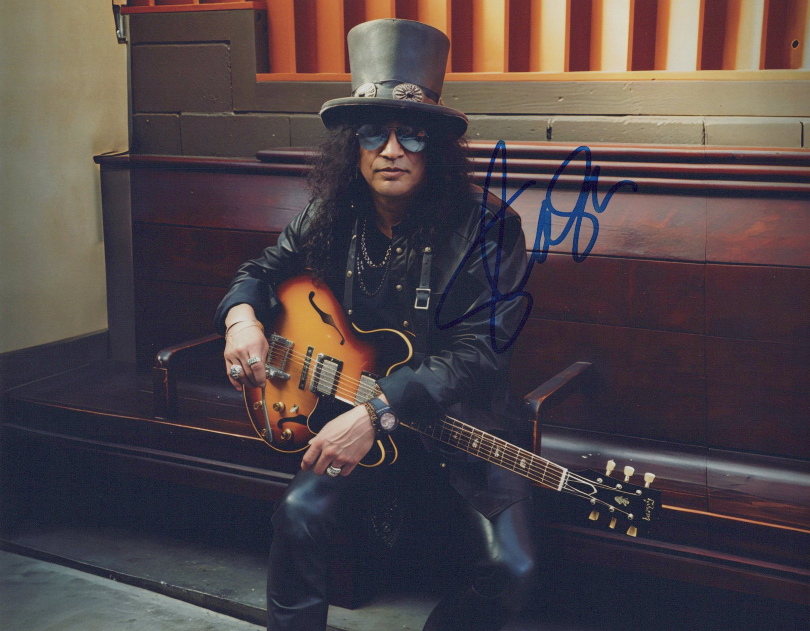 Saul Hudson (Slash Guns& Roses) GUITARIST In Person Signed Photo: Photo size is 8x10. Saul Hudson, known professionally as Slash, is a British-American musician who is known as the lead guitarist of the hard rock band Guns N' Roses, with whom he achieved worldwide s