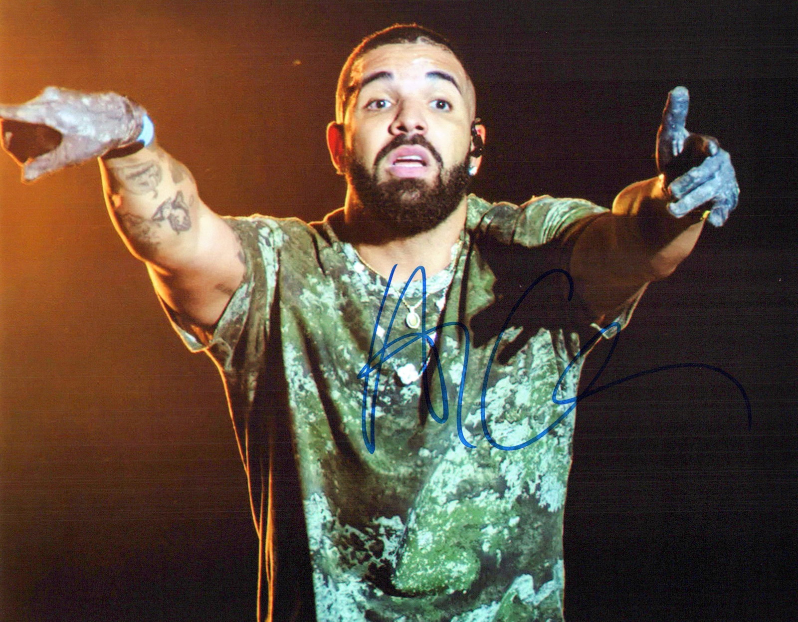 Aubrey "Drake" Graham WRAPPER In Person Signed Photo: Photo size is 8x10. Aubrey "Drake" Graham in person signed photo. Aubrey "Drake" Graham is a Canadian rapper and singer. He is credited with popularizing R&B sensibilities in hip-hop music through rap