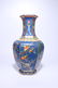 A CHINESE BLUE GLAZED FAMILLE ROSE HEXAGONAL VASE WITH