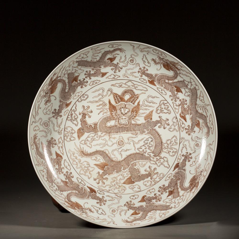 A CHINESE IRON RED PORCELAIN DRAGON DISH, QING DYNASTY (1 of 7)