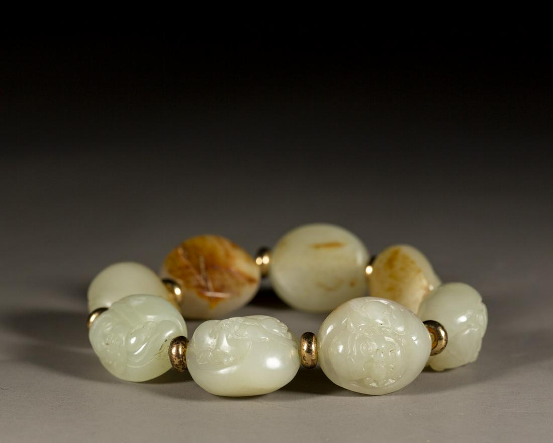 A CHINESE NEPHRITE JADE EIGHT DOASIT IMMORTALS BRACELET, 8BEADS, QING DYNASTY (1 of 5)
