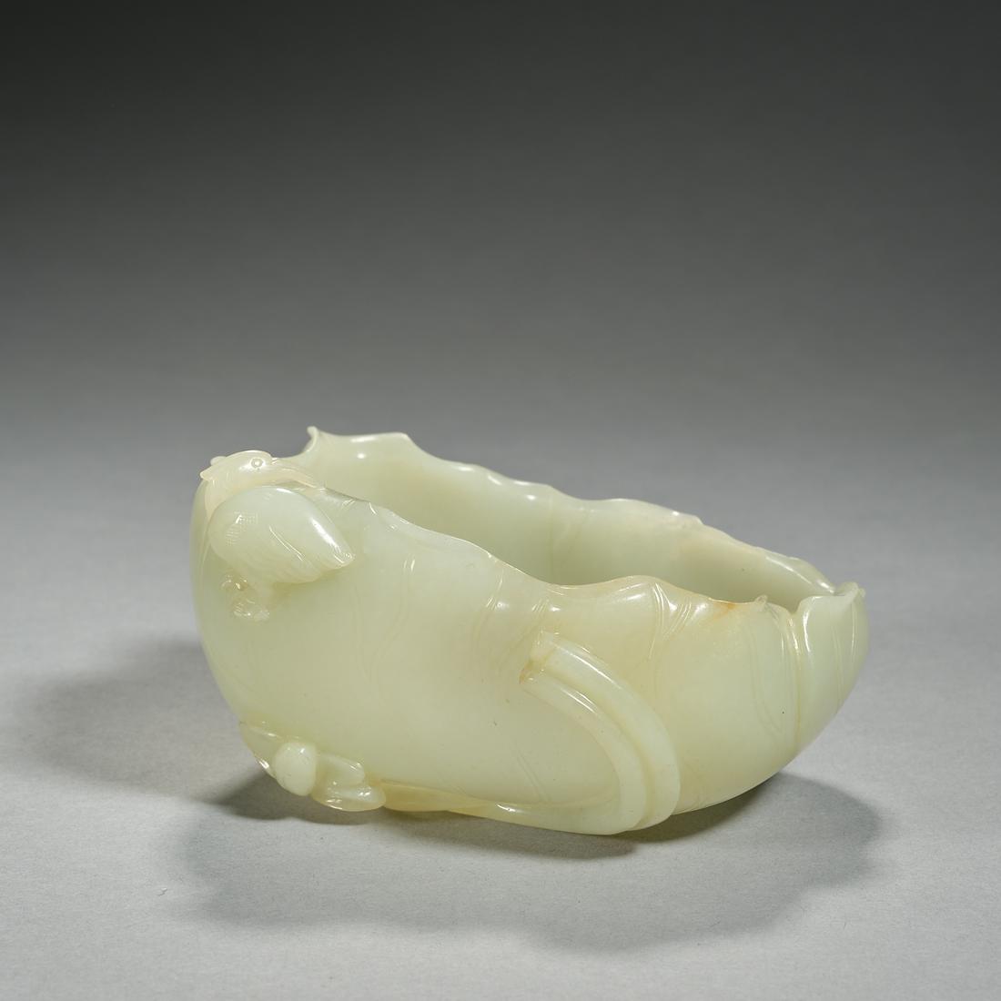 A JADE 'LOTUS LEAF AND BIRD' BRUSH WASHER, QING DYNASTY (1 of 6)