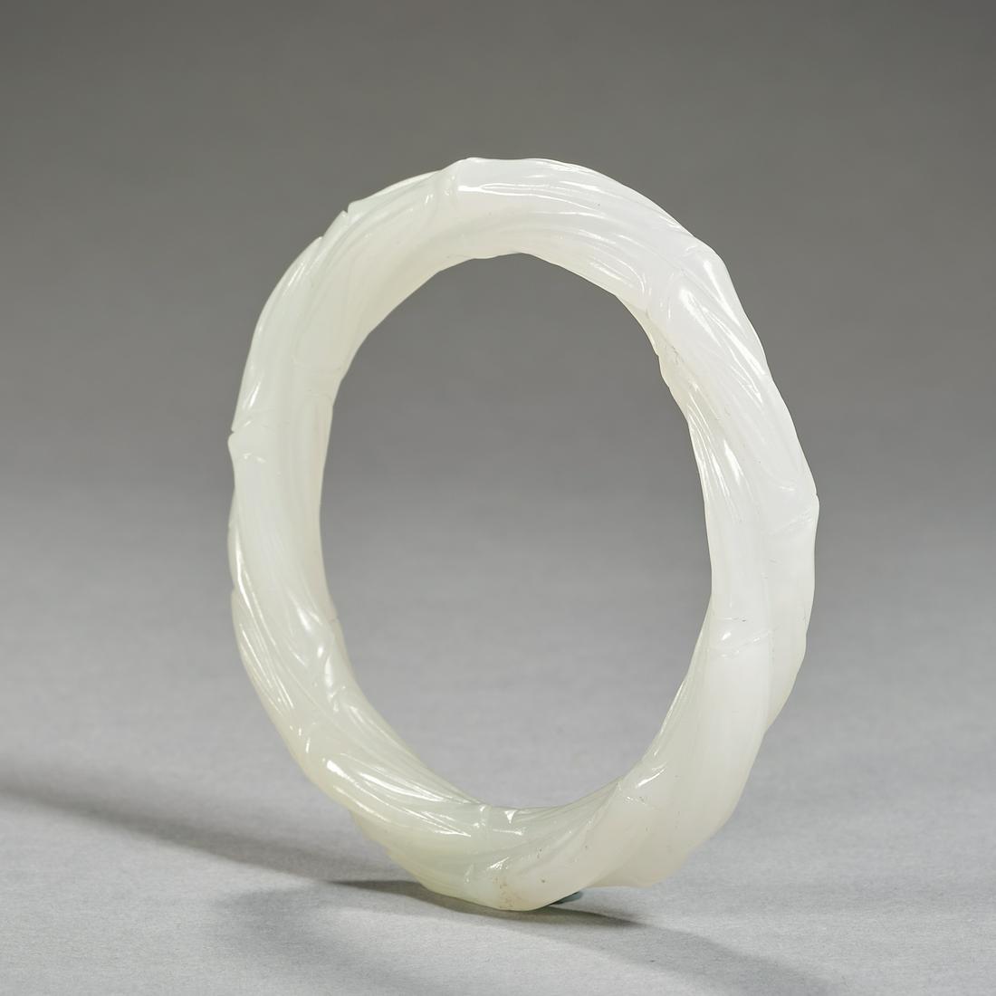 A WHITE JADE BRACELET, QING DYNASTY (1 of 6)