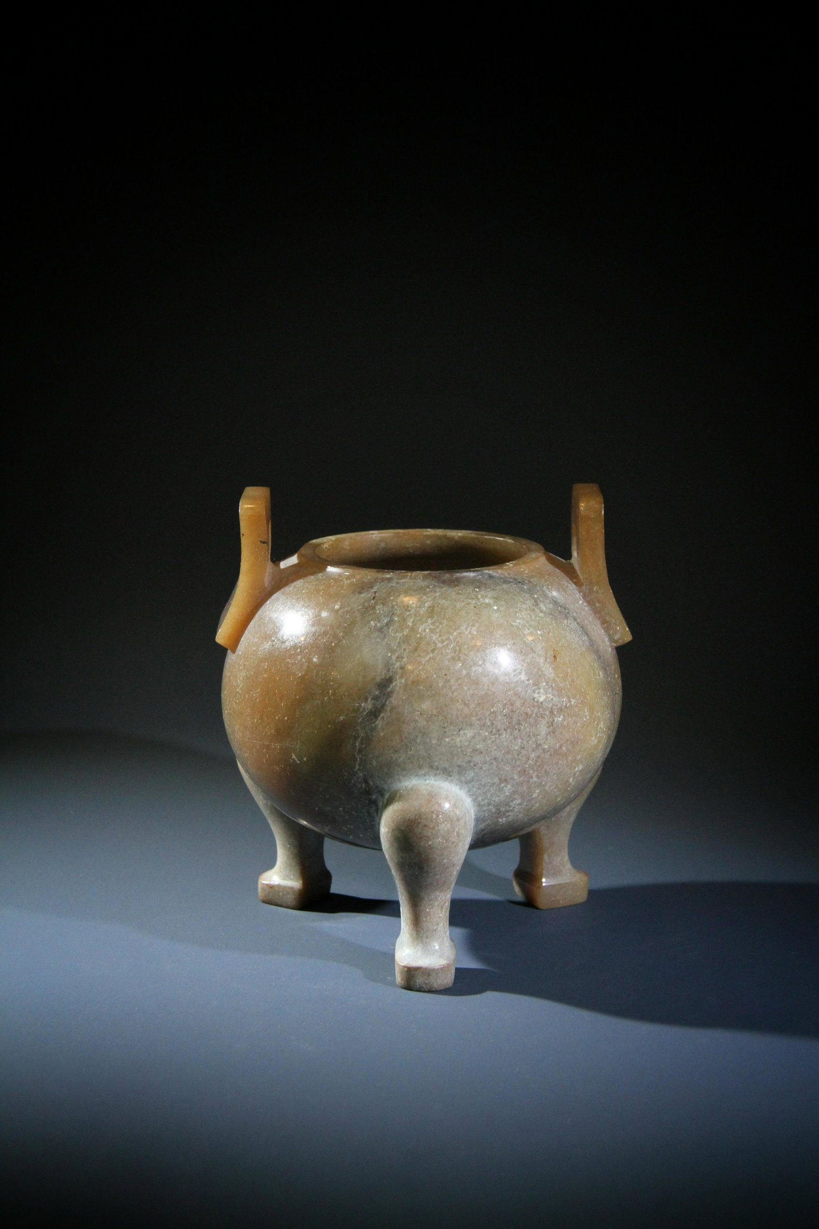 A CHINESE WHITE AND RUSSET JADE TRIPOD CENSER, WARRING STATE PERIOD (1 of 4)
