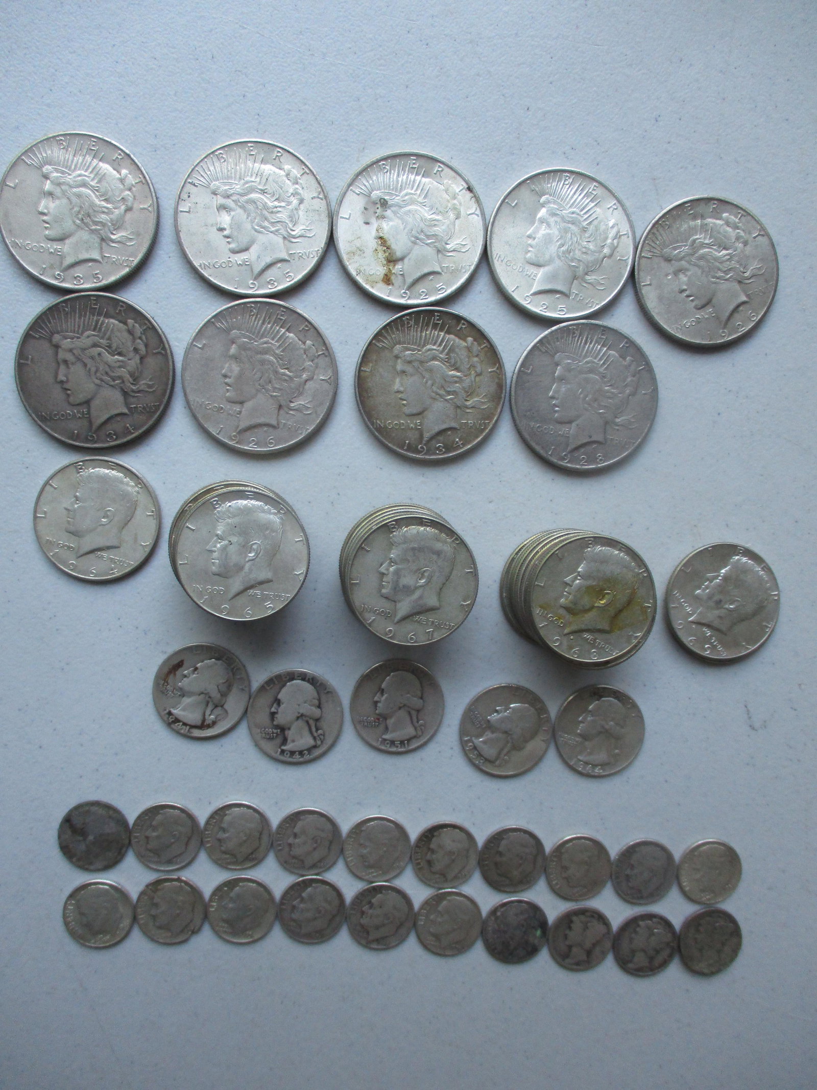 Peace Dollars, Kennedy Halfs and other Silver Coins: (2) 1925, (2) 1926, 1928, (2) 1934, 1935, 1935-S Peace Dollars, 1964 Kennedy Half, (32) Kennedy 40% Silver Halfs, (5) Silver Quarters and 20 Silver Dimes