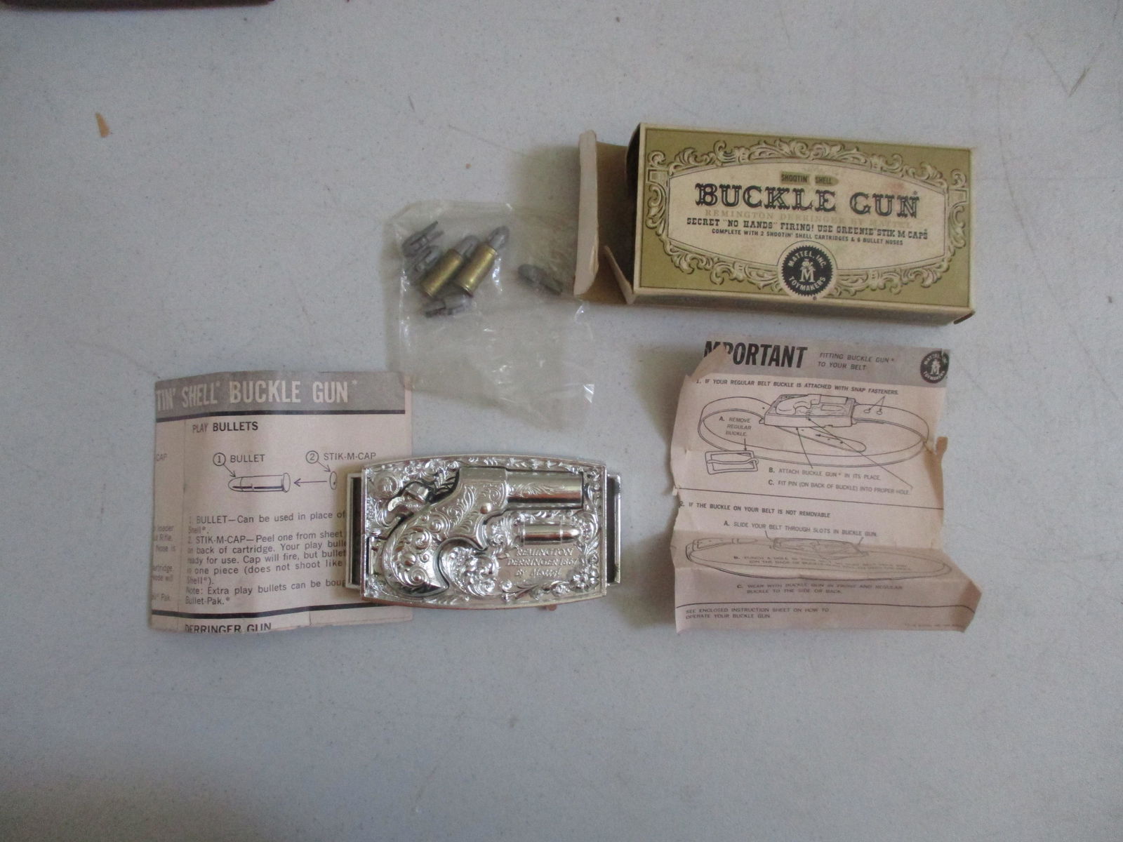 Mattel Buckle Gun With Unopened Bullets and: Mint in Box