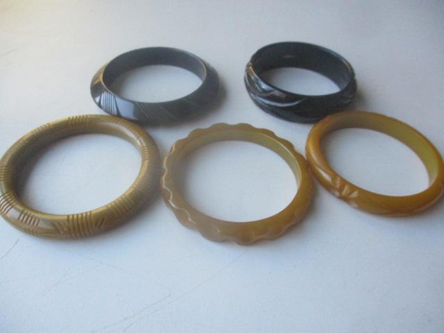 4 Carved Bakelite Bracelets & 1 Other: See photos for condition and details.