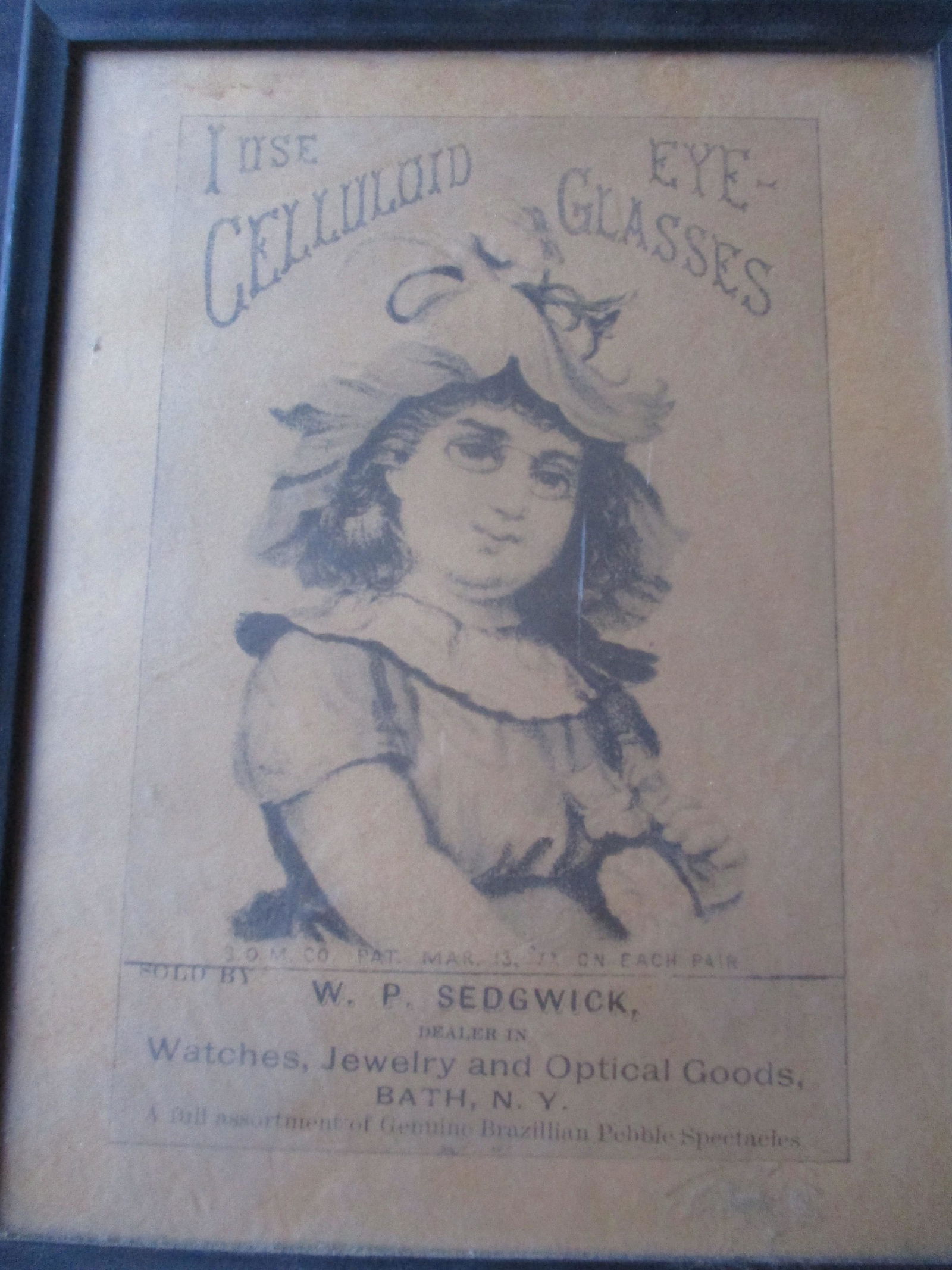 "Use Celluloid Eye Glasses" Advertising Print: Pat. 1877 - Fading - 11 1/2" x 9" Frame - See photos for condition and details