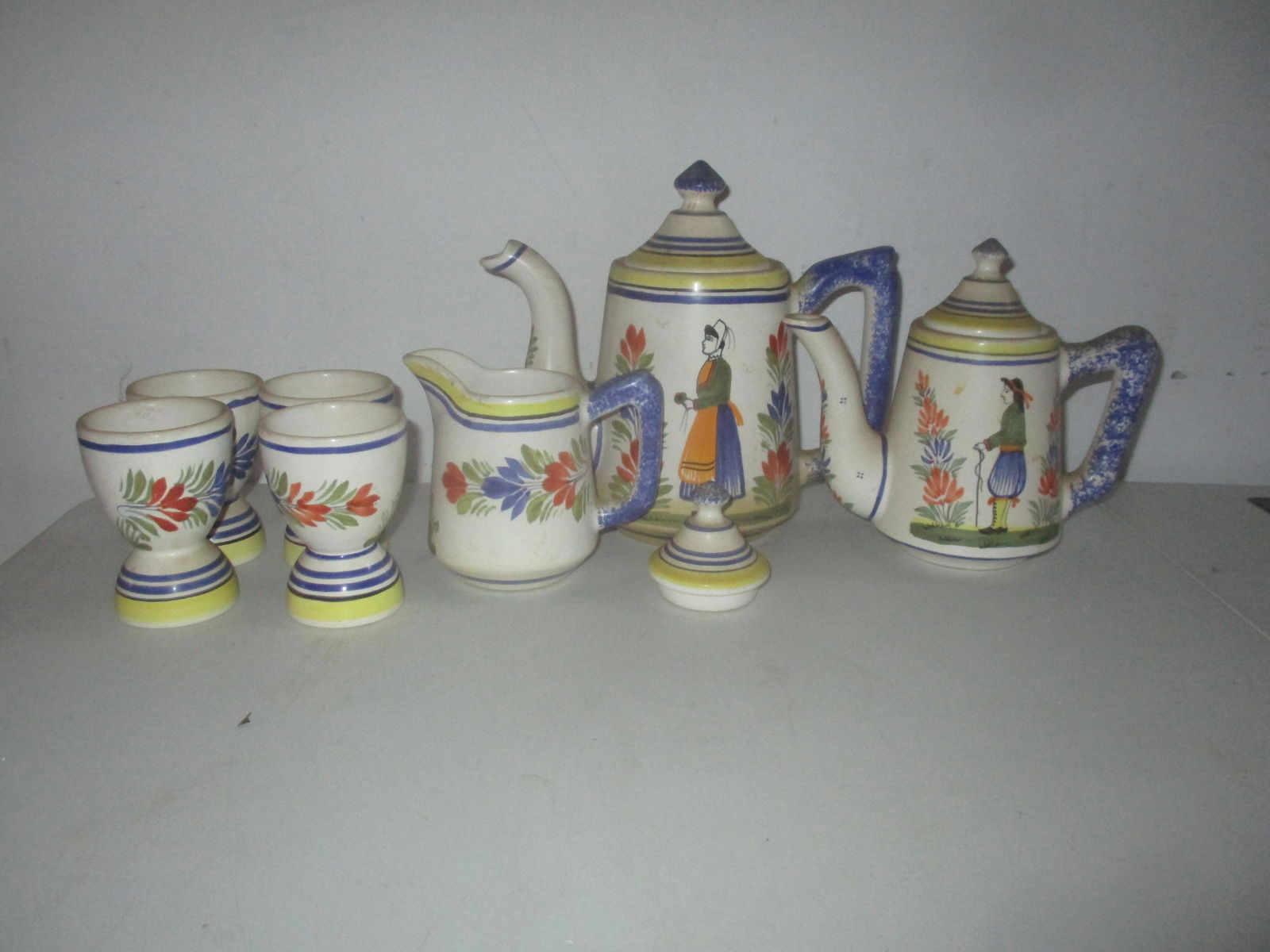 Henriot Quimper France Teapot, Coffee Pot, Etc.: Also - Creamer & 4 Egg Cups & Extra Top - Teapot 6 1/2", Coffee Pot 8" - See photos for condition and details