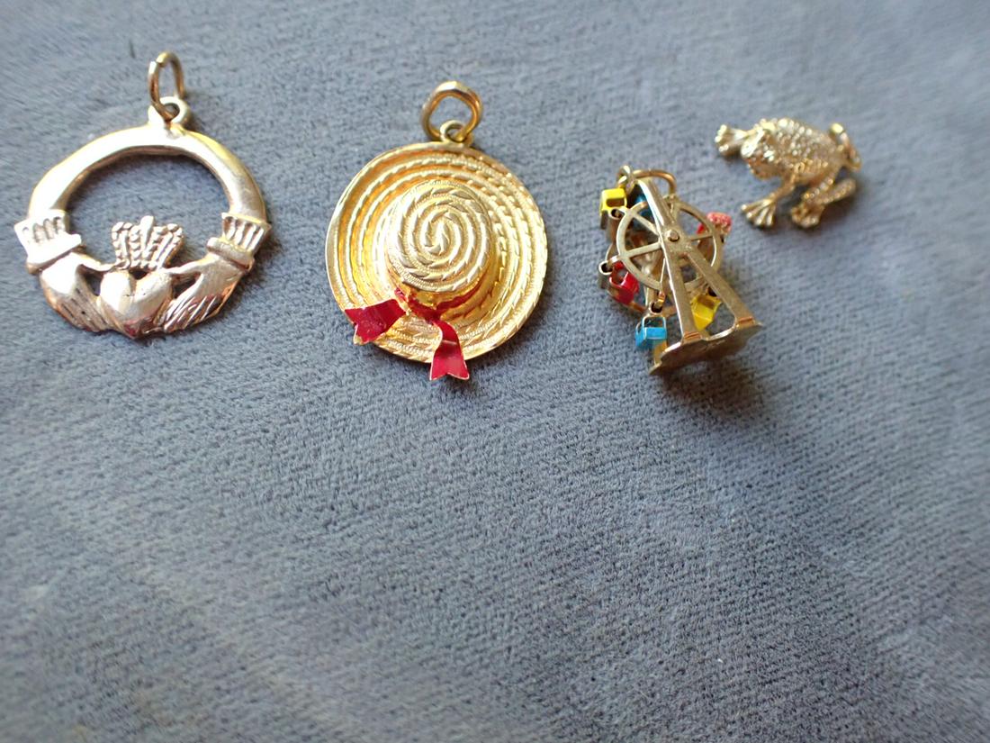 14K Clatter, Hat, Frog & Merry Go Round Charms: Appr. 9 Grams. Please see photos for details and condition.